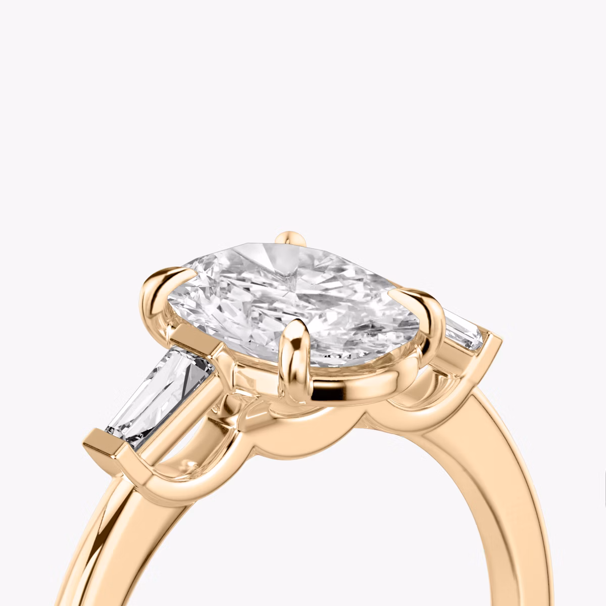 The Three Stone | Oval | 14k | Rose Gold | bandAccent: Plain | sideStoneCarat: 0.10ct | sideStoneShape: Tapered Baguette | diamondOrientation: vertical | caratWeight: other