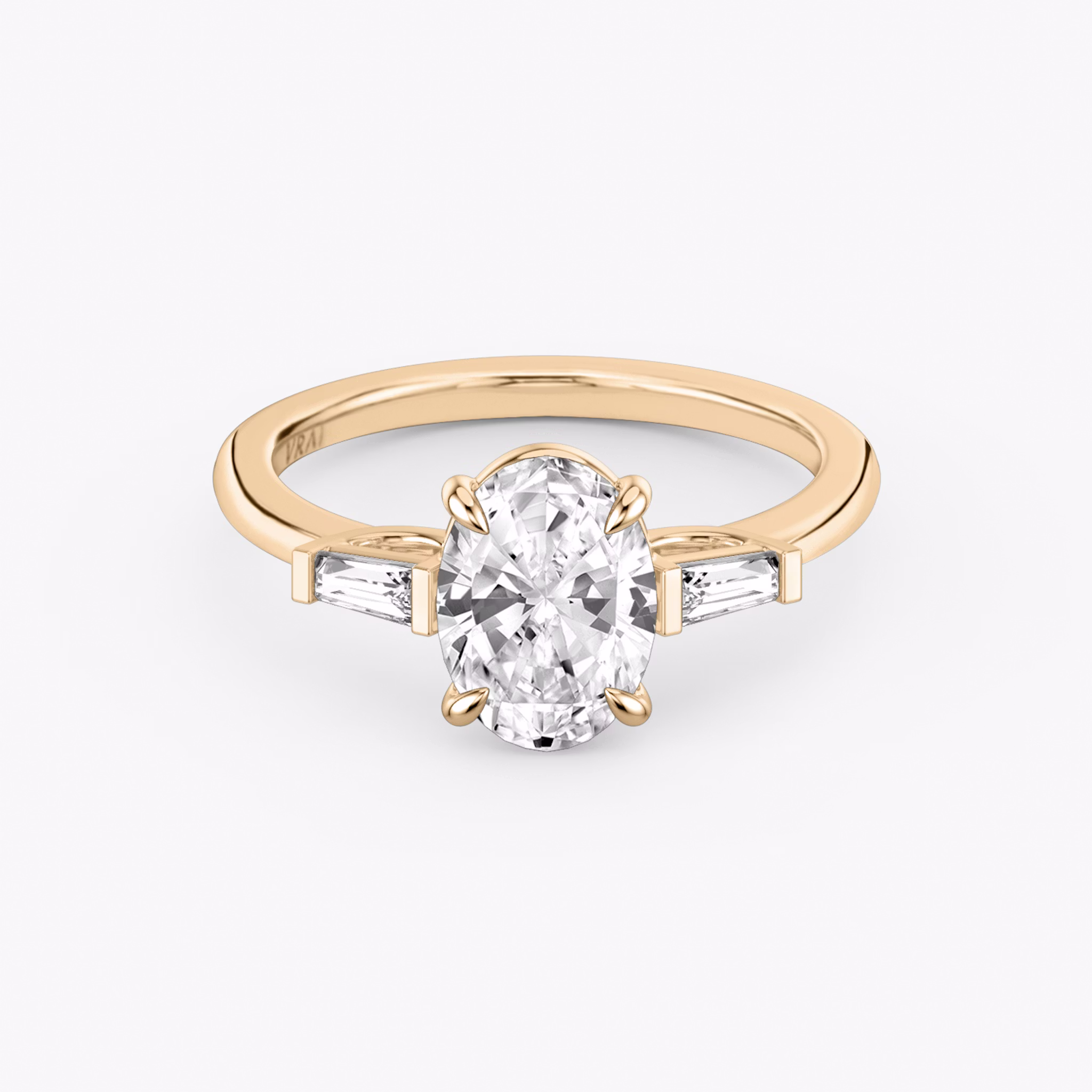 The Three Stone | Oval | 14k | Rose Gold | bandAccent: Plain | sideStoneCarat: 0.10ct | sideStoneShape: Tapered Baguette | diamondOrientation: vertical | caratWeight: other