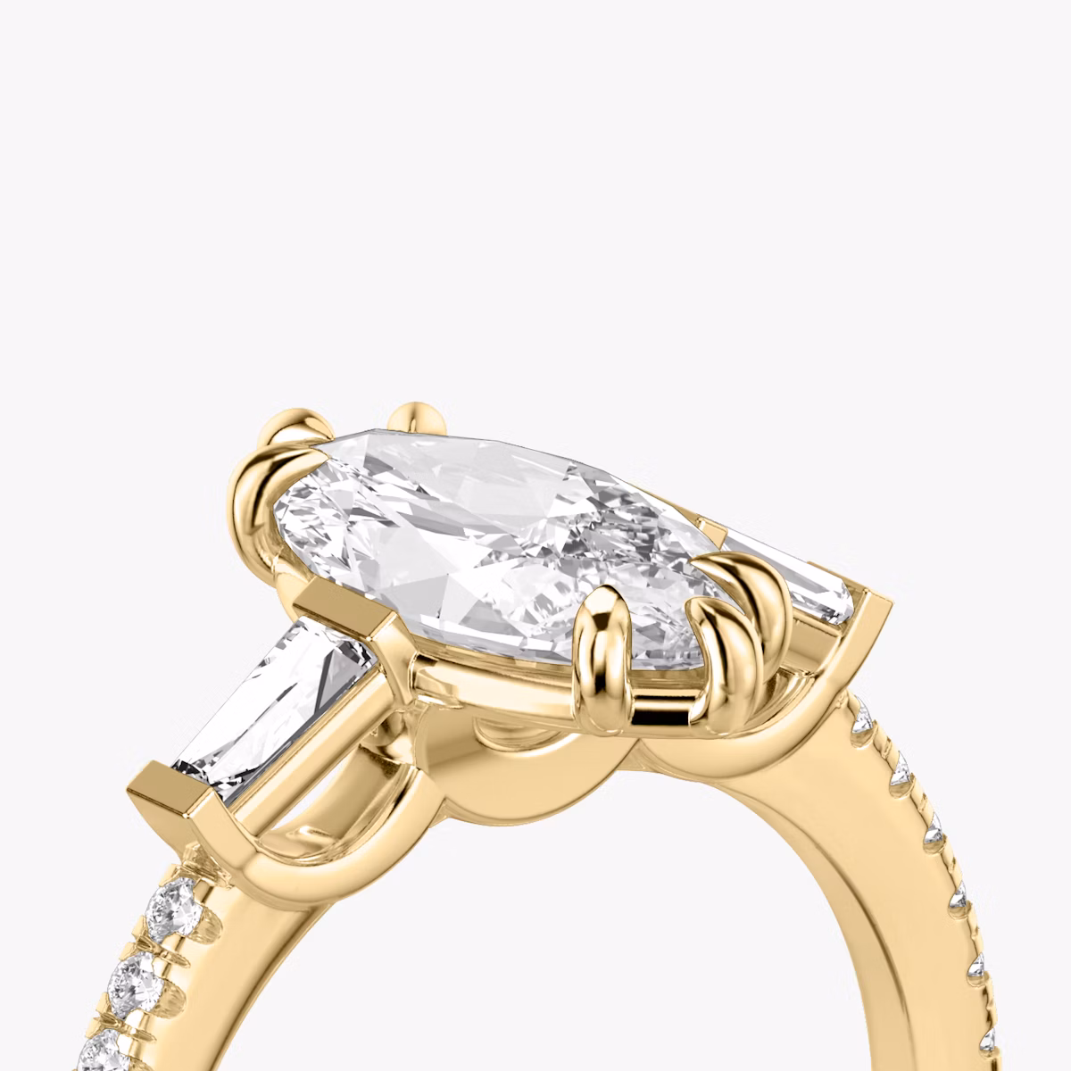 The Three Stone | Marquise | 18k | Yellow Gold | bandAccent: Pavé | sideStoneCarat: 0.10ct | sideStoneShape: Tapered Baguette | diamondOrientation: vertical | caratWeight: other