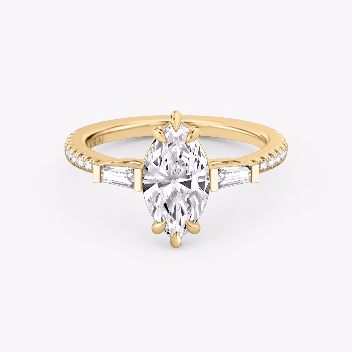 The Three Stone | Marquise | 18k | Yellow Gold | bandAccent: Pavé | sideStoneCarat: 0.10ct | sideStoneShape: Tapered Baguette | diamondOrientation: vertical | caratWeight: other