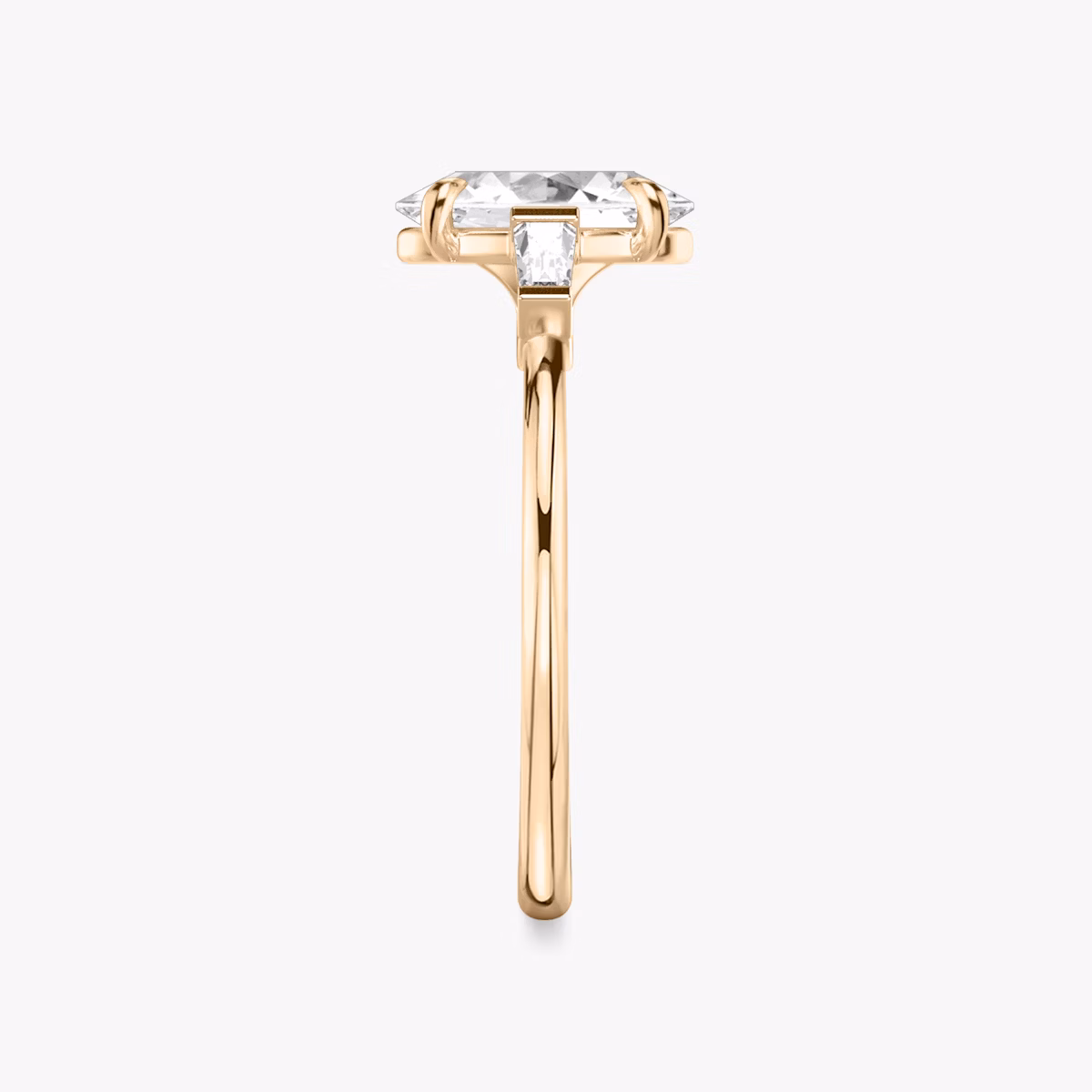 The Three Stone | Oval | 14k | Rose Gold | bandAccent: Plain | sideStoneCarat: 0.10ct | sideStoneShape: Tapered Baguette | diamondOrientation: vertical | caratWeight: other