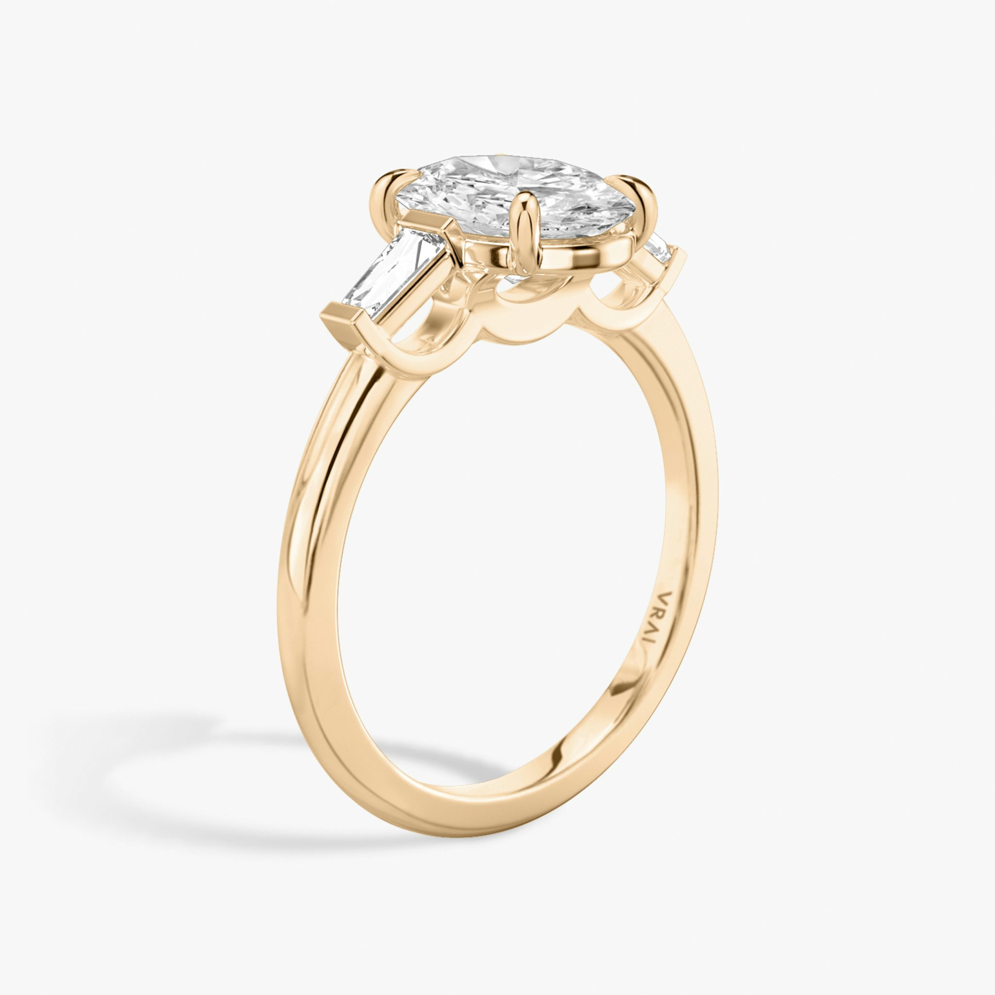The Three Stone | Oval | 14k | Rose Gold | bandAccent: Plain | sideStoneCarat: 0.10ct | sideStoneShape: Tapered Baguette | diamondOrientation: vertical | caratWeight: other