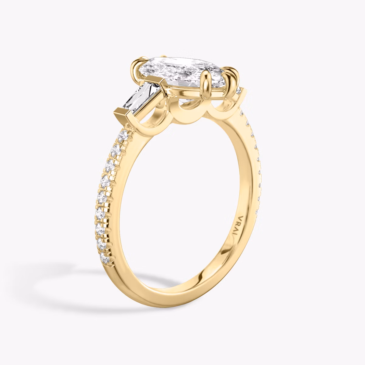 The Three Stone | Marquise | 18k | Yellow Gold | bandAccent: Pavé | sideStoneCarat: 0.10ct | sideStoneShape: Tapered Baguette | diamondOrientation: vertical | caratWeight: other
