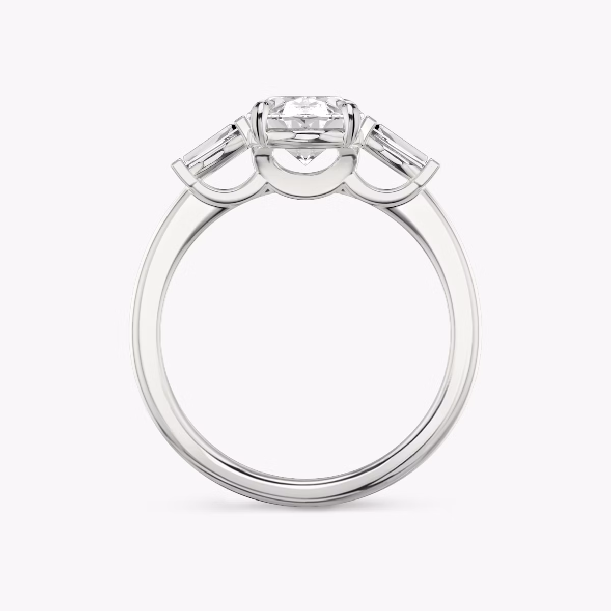 The Three Stone | Oval | 18k | White Gold | bandAccent: Plain | sideStoneCarat: 0.10ct | sideStoneShape: Tapered Baguette | diamondOrientation: vertical | caratWeight: other