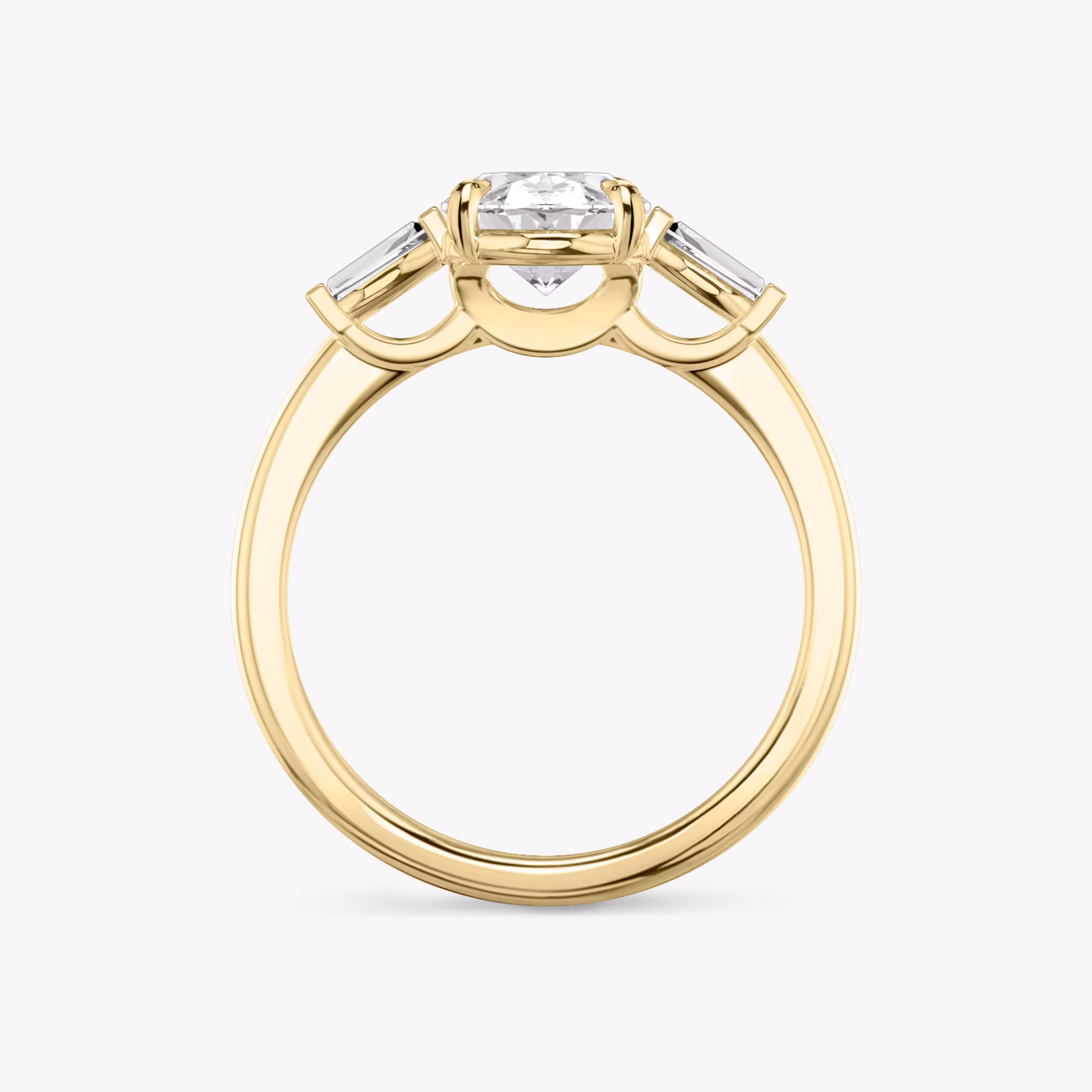 The Three Stone | Oval | 18k | Yellow Gold | bandAccent: Plain | sideStoneCarat: 0.10ct | sideStoneShape: Tapered Baguette | diamondOrientation: vertical | caratWeight: other