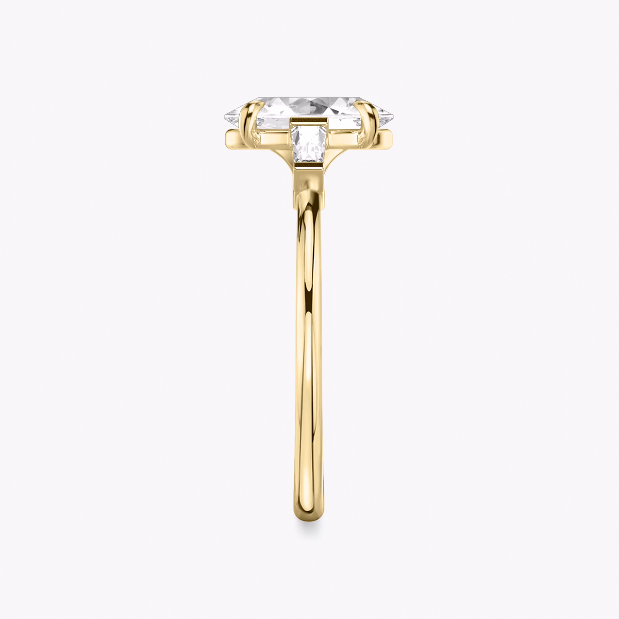 The Three Stone | Oval | 18k | Yellow Gold | bandAccent: Plain | sideStoneCarat: 0.10ct | sideStoneShape: Tapered Baguette | diamondOrientation: vertical | caratWeight: other