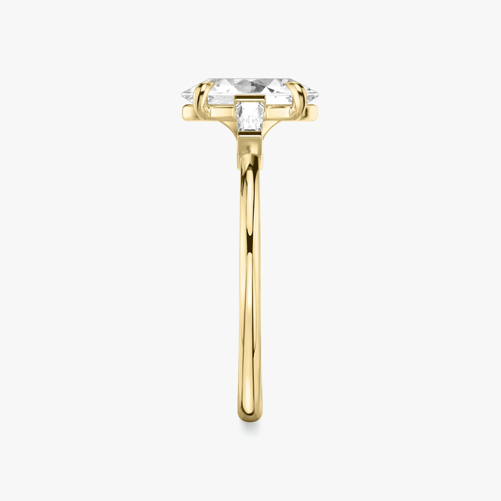 The Three Stone | Oval | 18k | Yellow Gold | bandAccent: Plain | sideStoneCarat: 0.10ct | sideStoneShape: Tapered Baguette | diamondOrientation: vertical | caratWeight: other