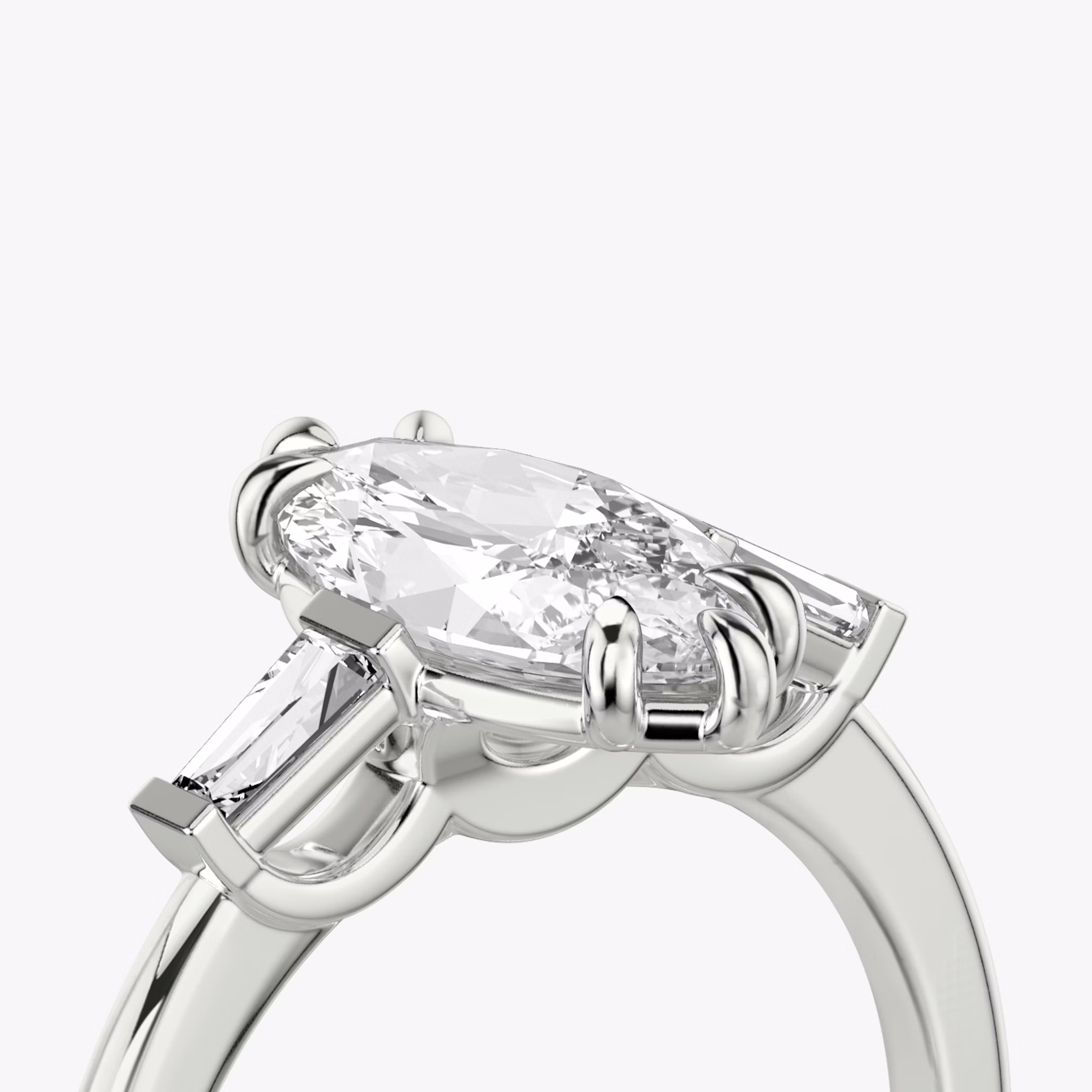 The Three Stone | Marquise | 18k | White Gold | bandAccent: Plain | sideStoneCarat: 0.10ct | sideStoneShape: Tapered Baguette | diamondOrientation: vertical | caratWeight: other