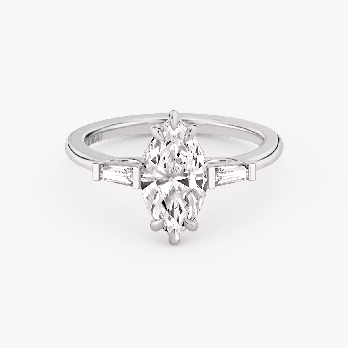 The Three Stone | Marquise | 18k | White Gold | bandAccent: Plain | sideStoneCarat: 0.10ct | sideStoneShape: Tapered Baguette | diamondOrientation: vertical | caratWeight: other