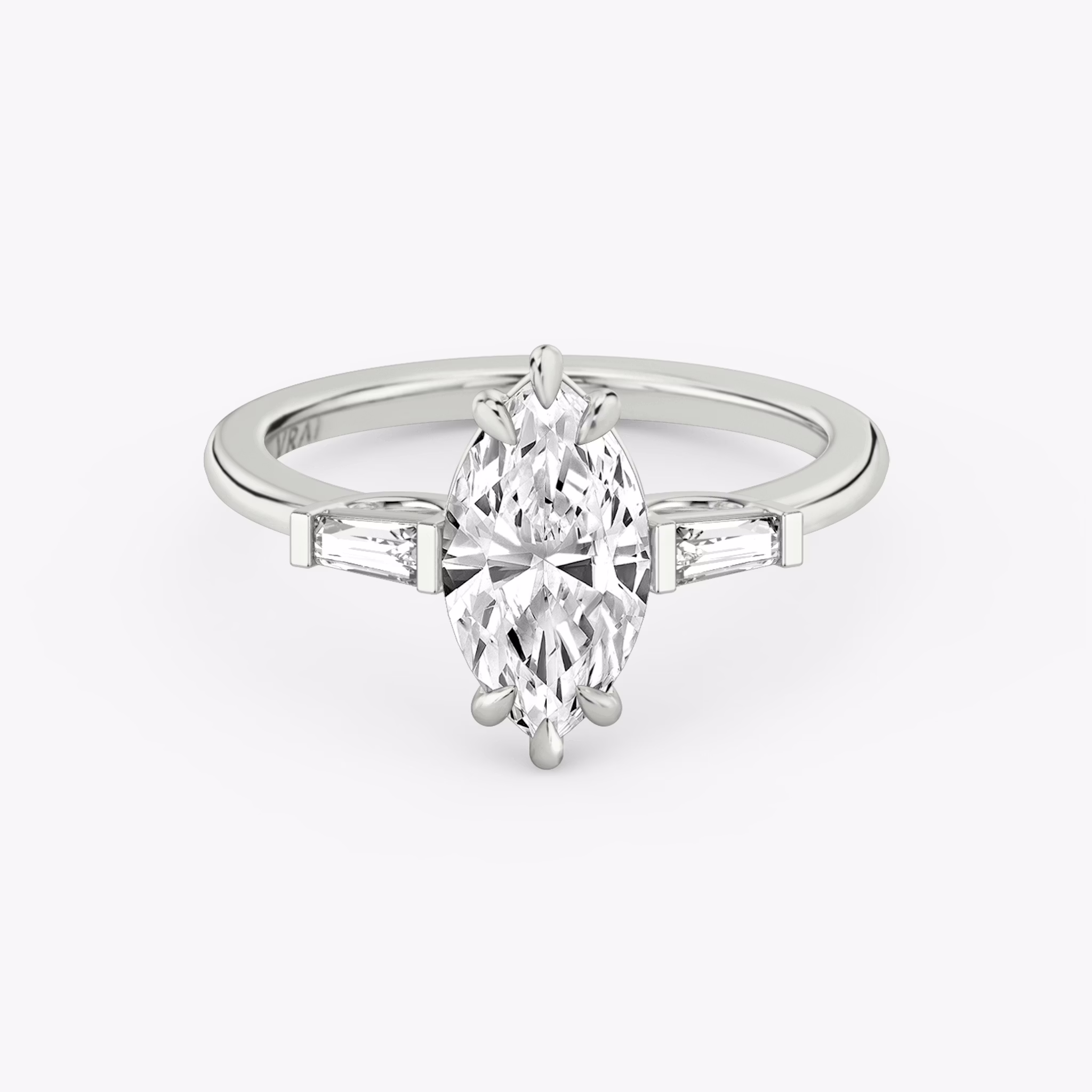 The Three Stone | Marquise | 18k | White Gold | bandAccent: Plain | sideStoneCarat: 0.10ct | sideStoneShape: Tapered Baguette | diamondOrientation: vertical | caratWeight: other