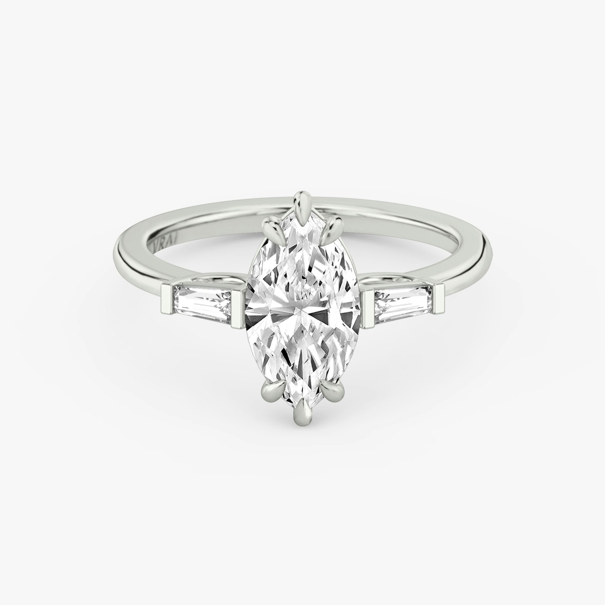 The Three Stone | Marquise | 18k | White Gold | bandAccent: Plain | sideStoneCarat: 0.10ct | sideStoneShape: Tapered Baguette | diamondOrientation: vertical | caratWeight: other