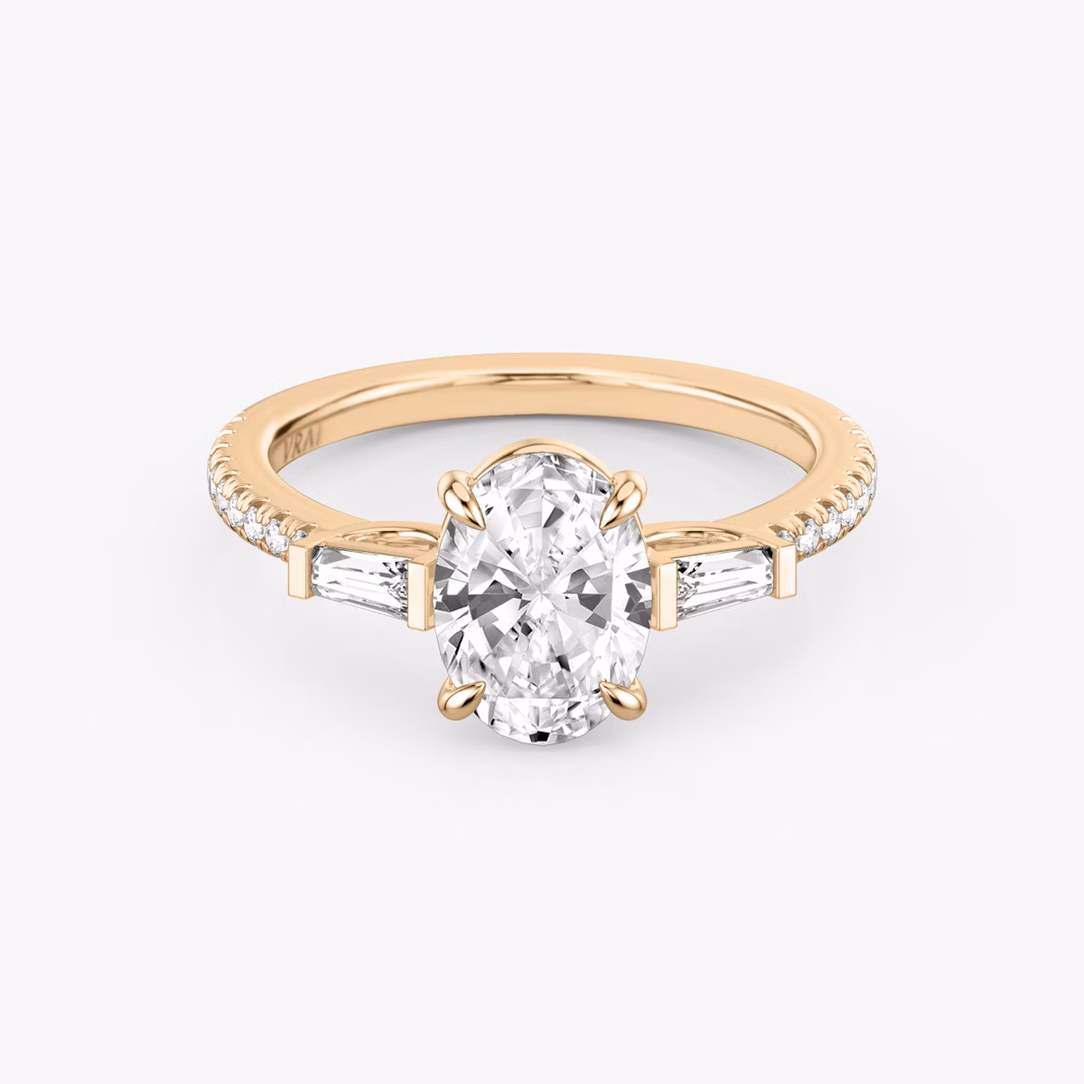 The Three Stone | Oval | 14k | Rose Gold | bandAccent: Pavé | sideStoneCarat: 0.10ct | sideStoneShape: Tapered Baguette | diamondOrientation: vertical | caratWeight: other