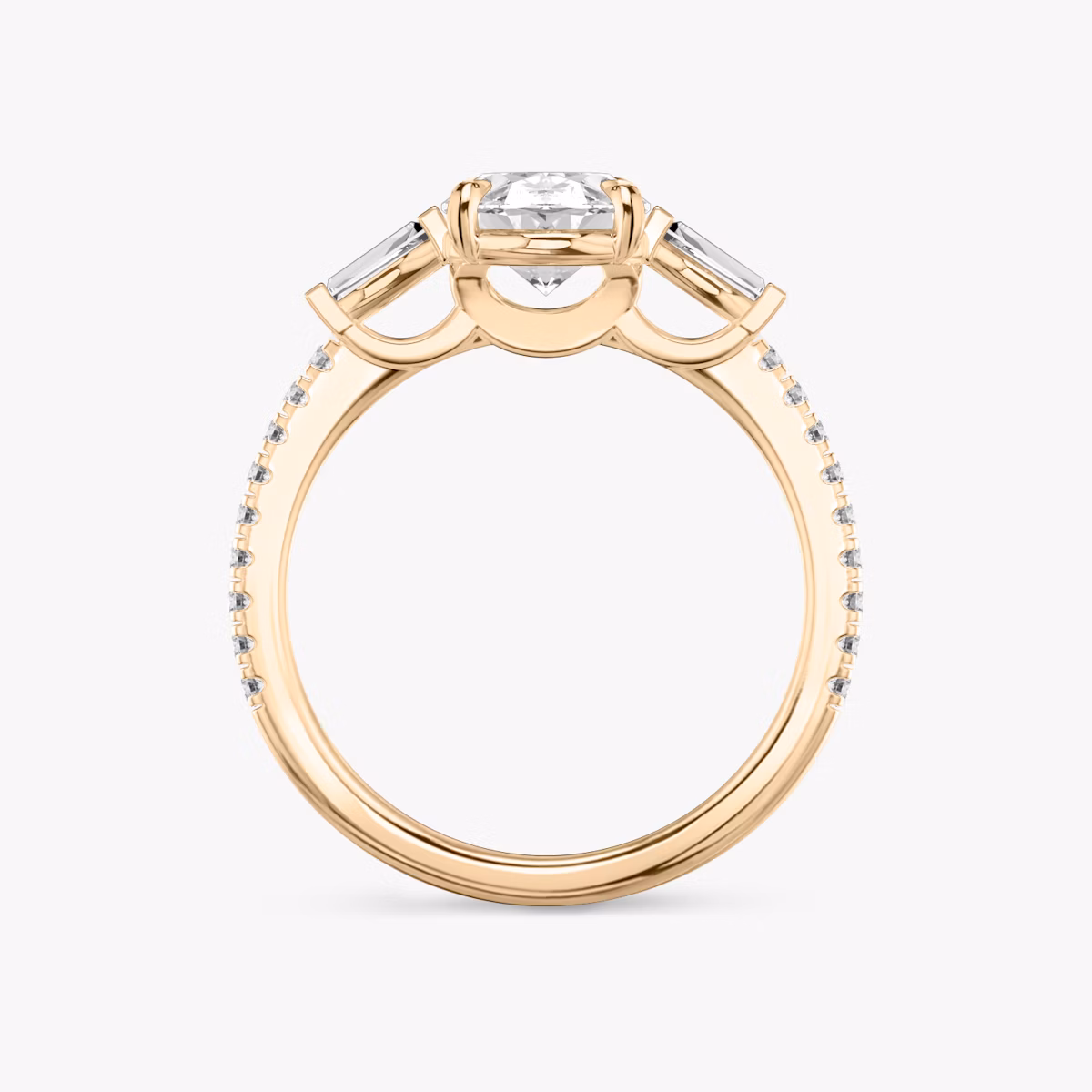The Three Stone | Oval | 14k | Rose Gold | bandAccent: Pavé | sideStoneCarat: 0.10ct | sideStoneShape: Tapered Baguette | diamondOrientation: vertical | caratWeight: other