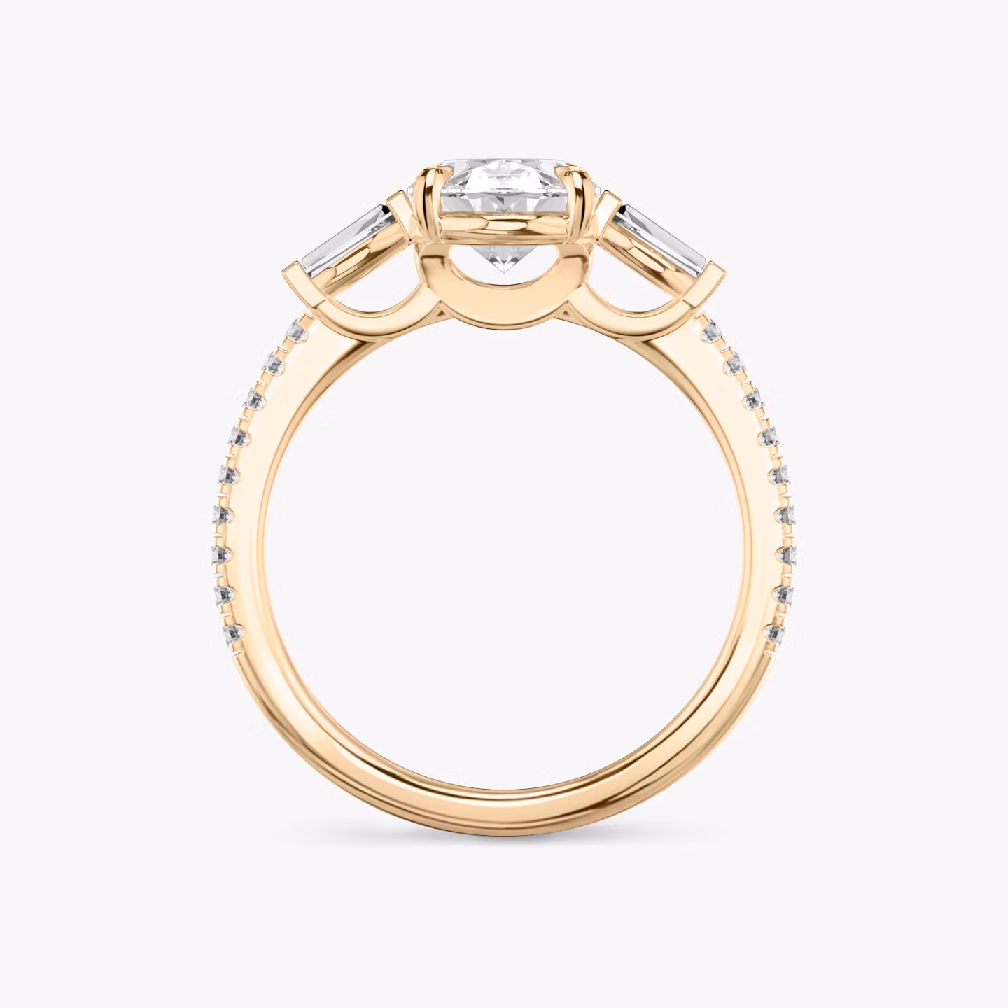 The Three Stone | Oval | 14k | Rose Gold | bandAccent: Pavé | sideStoneCarat: 0.10ct | sideStoneShape: Tapered Baguette | diamondOrientation: vertical | caratWeight: other