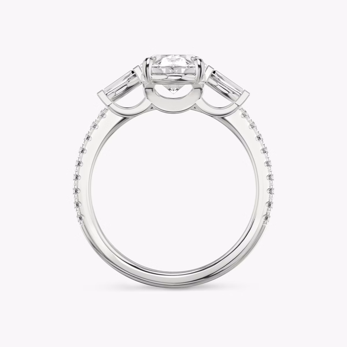 The Three Stone | Oval | Platinum | bandAccent: Pavé | sideStoneCarat: 0.10ct | sideStoneShape: Tapered Baguette | diamondOrientation: vertical | caratWeight: other