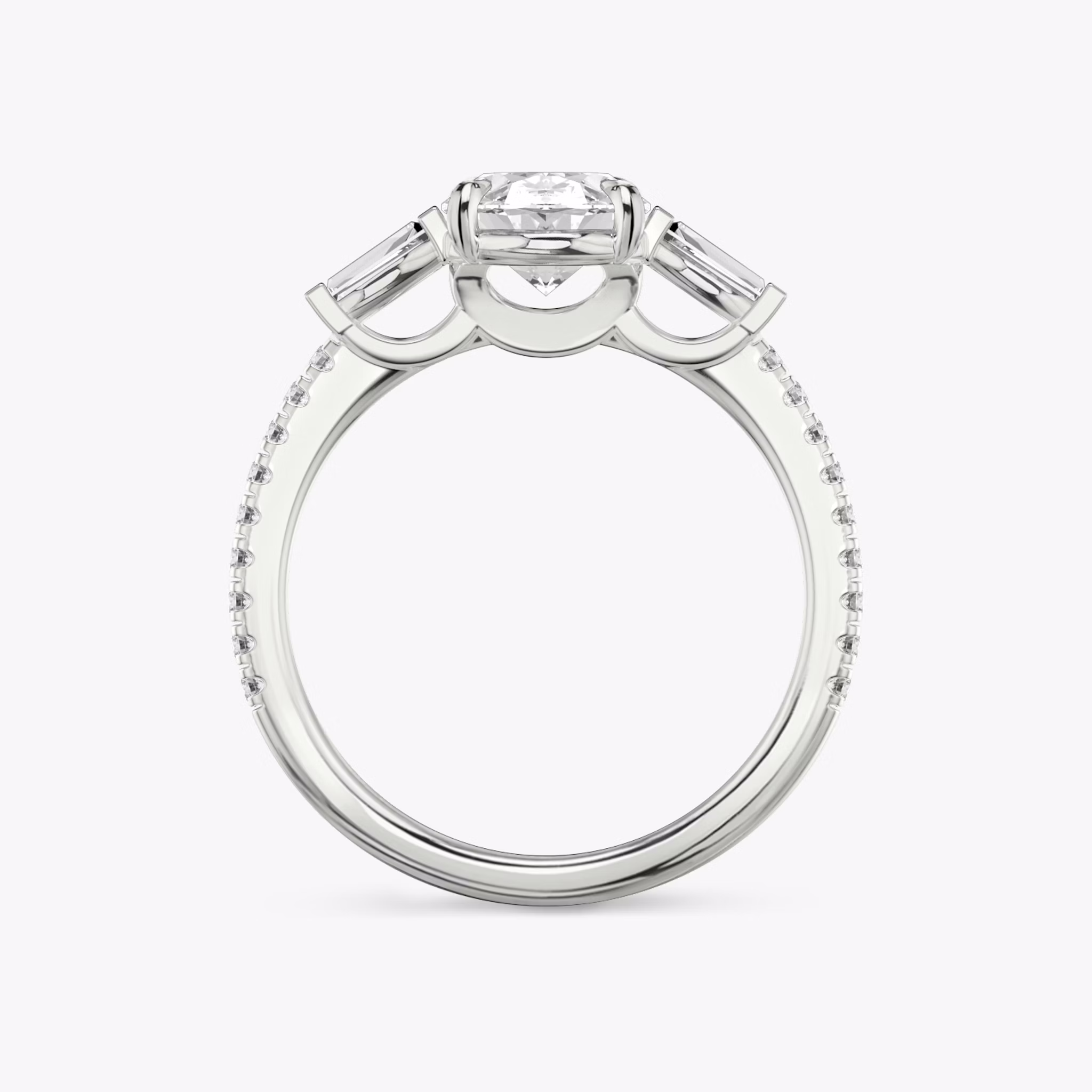 The Three Stone | Oval | 18k | White Gold | bandAccent: Pavé | sideStoneCarat: 0.10ct | sideStoneShape: Tapered Baguette | diamondOrientation: vertical | caratWeight: other