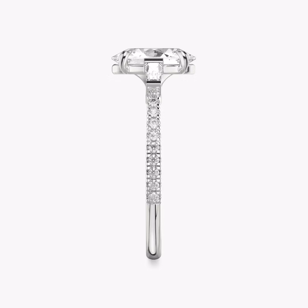 The Three Stone | Oval | Platinum | bandAccent: Pavé | sideStoneCarat: 0.10ct | sideStoneShape: Tapered Baguette | diamondOrientation: vertical | caratWeight: other
