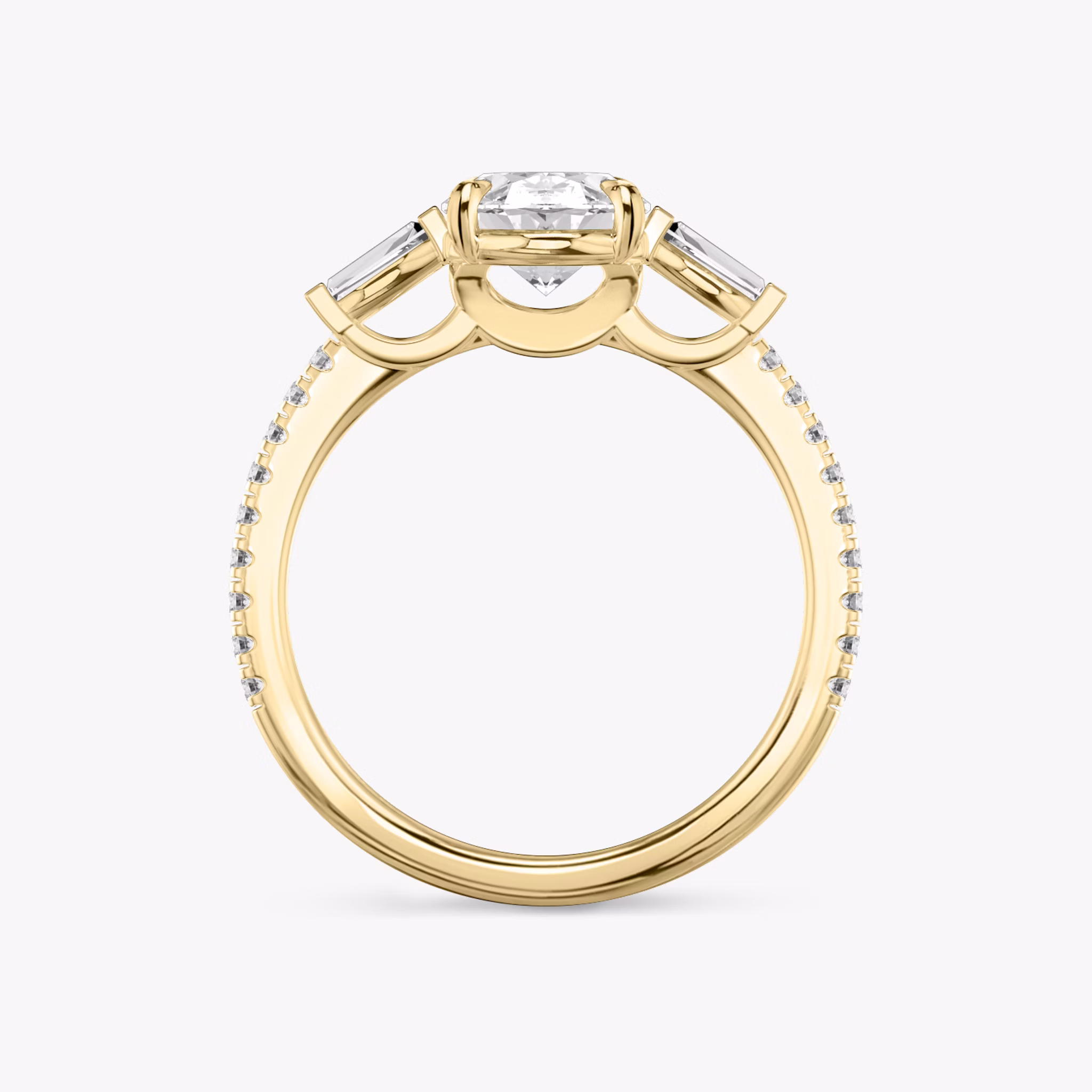 The Three Stone | Oval | 18k | Yellow Gold | bandAccent: Pavé | sideStoneCarat: 0.10ct | sideStoneShape: Tapered Baguette | diamondOrientation: vertical | caratWeight: other