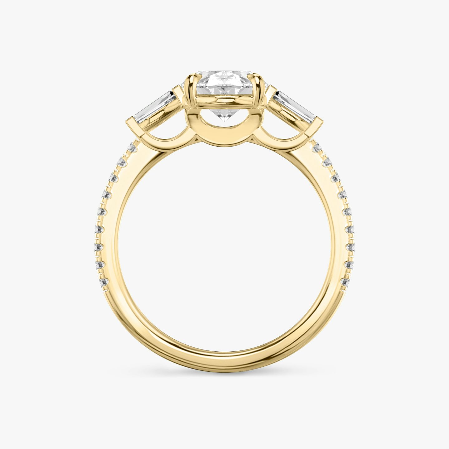 The Three Stone | Oval | 18k | Yellow Gold | bandAccent: Pavé | sideStoneCarat: 0.10ct | sideStoneShape: Tapered Baguette | diamondOrientation: vertical | caratWeight: other