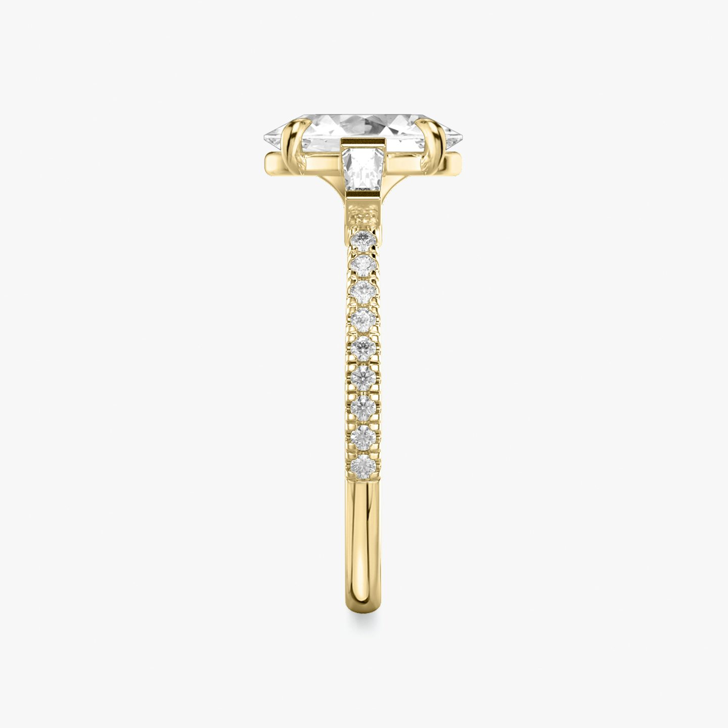 The Three Stone | Oval | 18k | Yellow Gold | bandAccent: Pavé | sideStoneCarat: 0.10ct | sideStoneShape: Tapered Baguette | diamondOrientation: vertical | caratWeight: other
