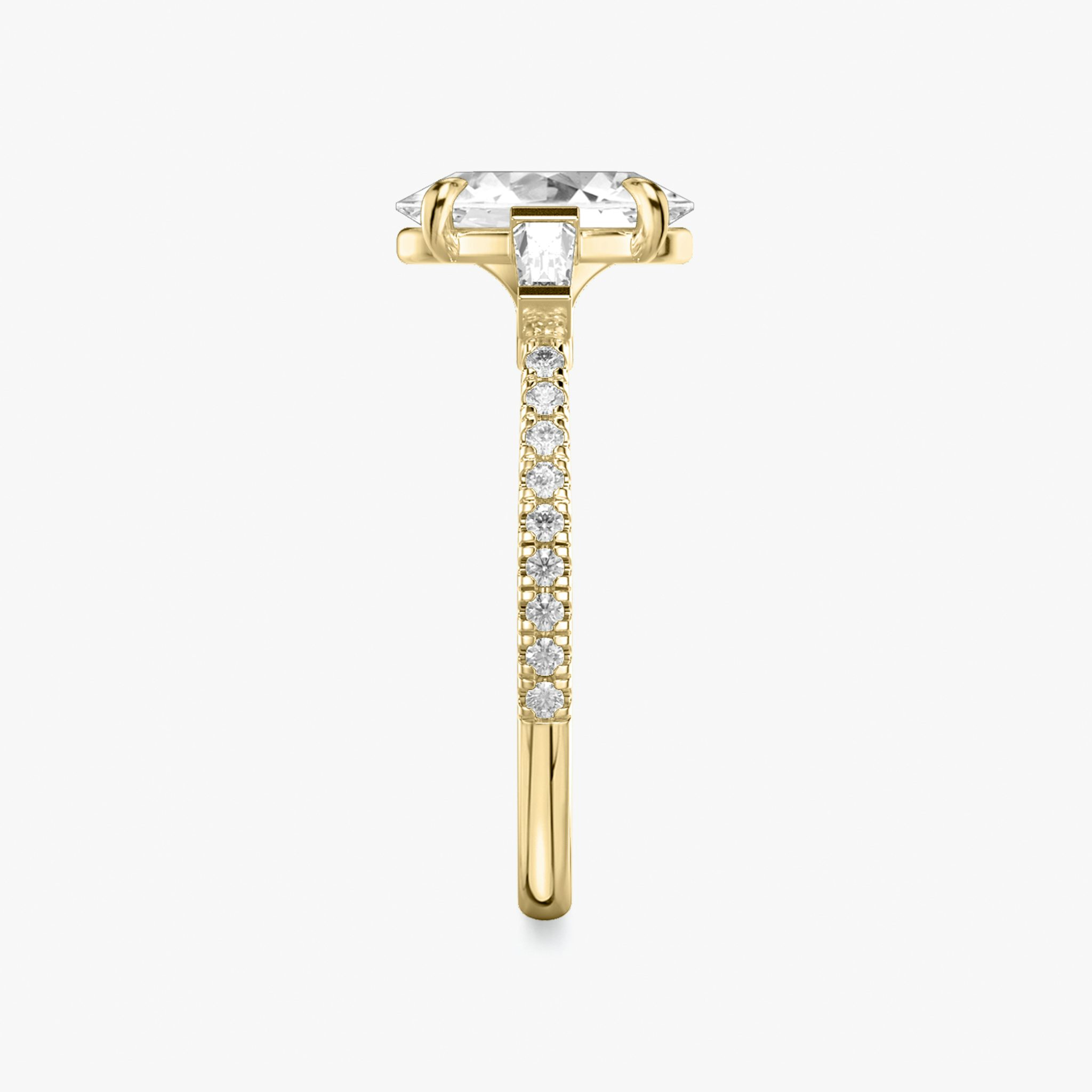 The Three Stone | Oval | 18k | Yellow Gold | bandAccent: Pavé | sideStoneCarat: 0.10ct | sideStoneShape: Tapered Baguette | diamondOrientation: vertical | caratWeight: other