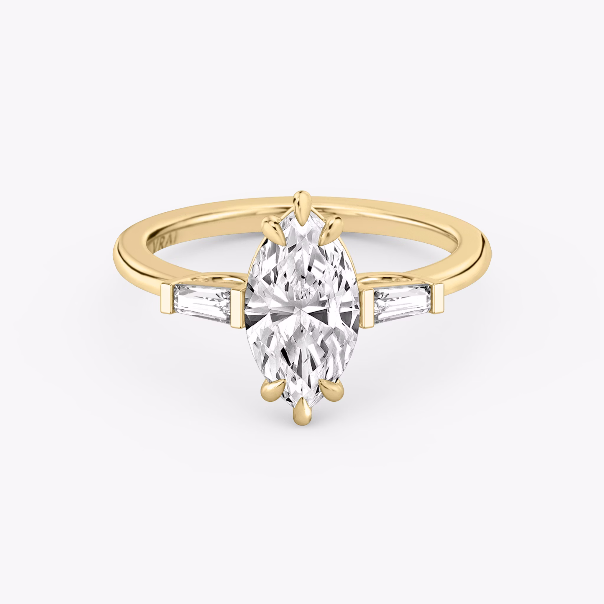 The Three Stone | Marquise | 18k | Yellow Gold | bandAccent: Plain | sideStoneCarat: 0.10ct | sideStoneShape: Tapered Baguette | diamondOrientation: vertical | caratWeight: other