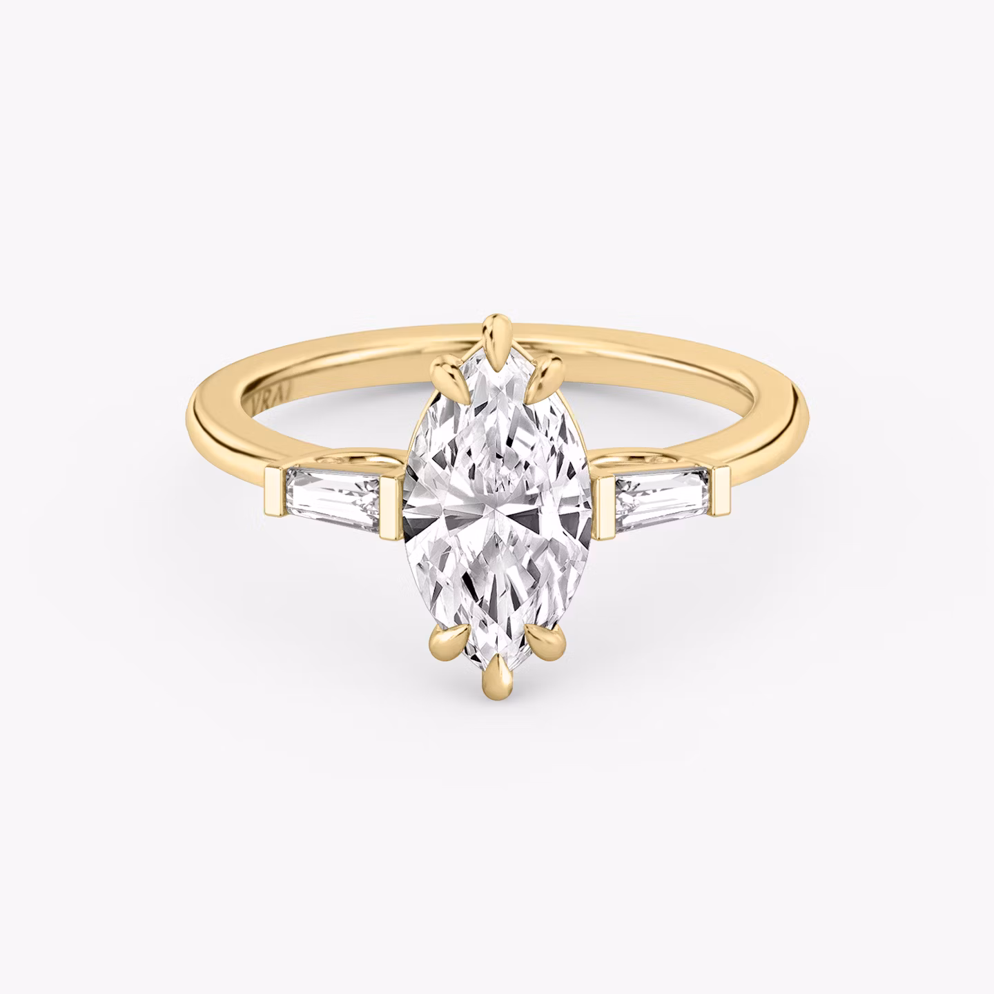 The Three Stone | Marquise | 18k | Yellow Gold | bandAccent: Plain | sideStoneCarat: 0.10ct | sideStoneShape: Tapered Baguette | diamondOrientation: vertical | caratWeight: other