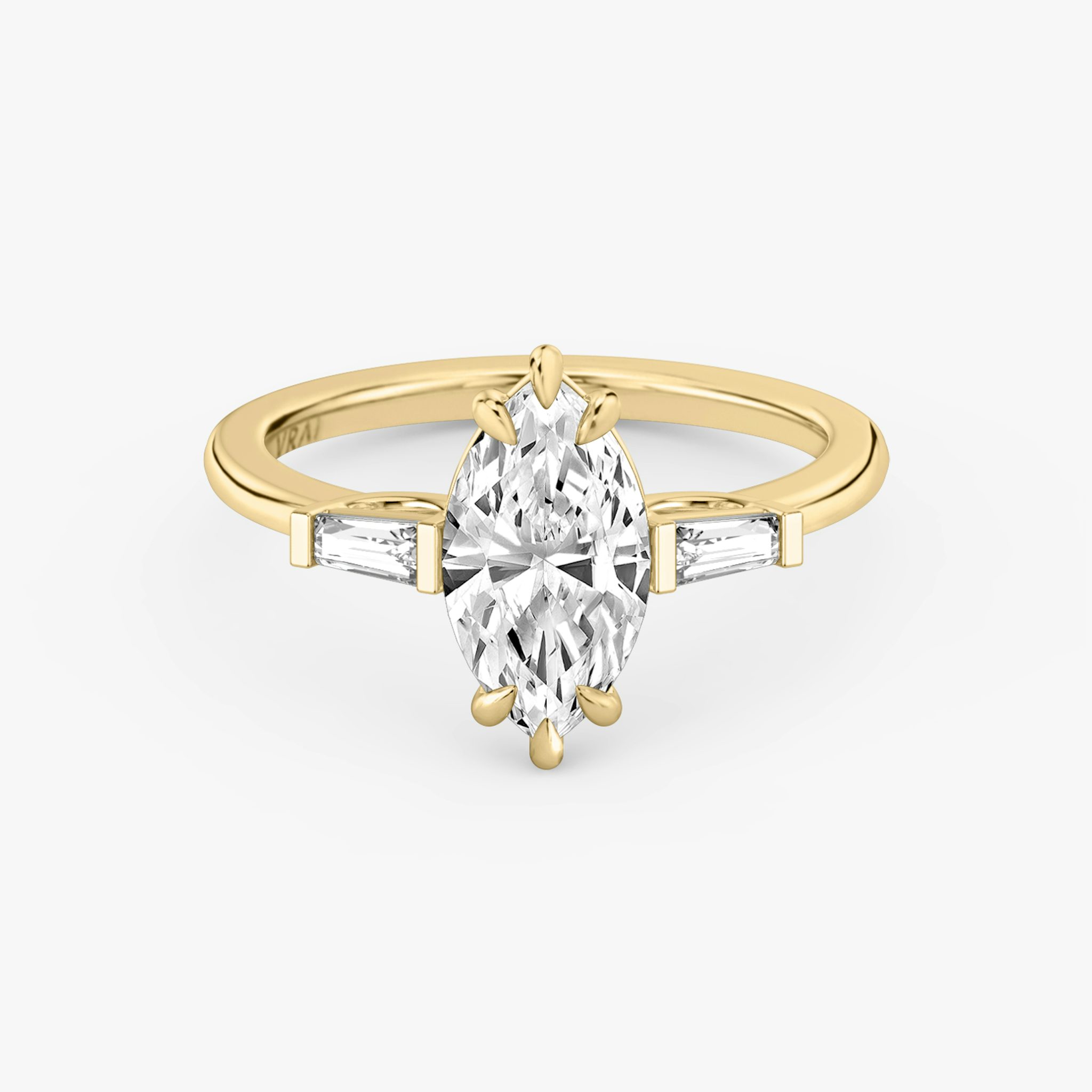 The Three Stone | Marquise | 18k | Yellow Gold | bandAccent: Plain | sideStoneCarat: 0.10ct | sideStoneShape: Tapered Baguette | diamondOrientation: vertical | caratWeight: other