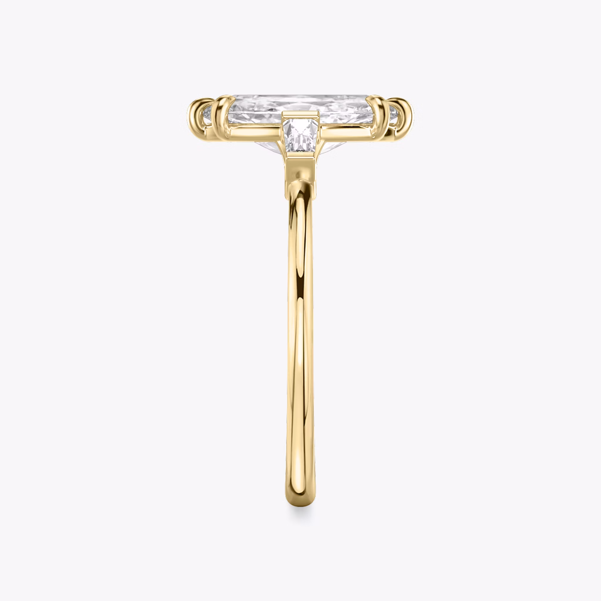 The Three Stone | Marquise | 18k | Yellow Gold | bandAccent: Plain | sideStoneCarat: 0.10ct | sideStoneShape: Tapered Baguette | diamondOrientation: vertical | caratWeight: other