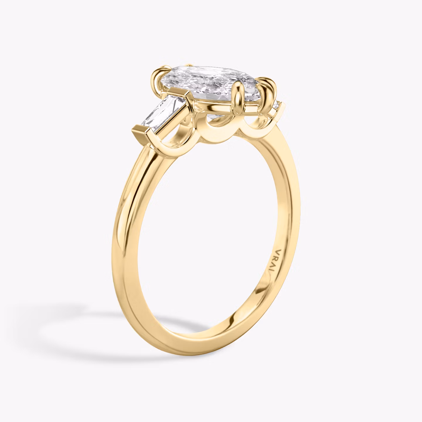 The Three Stone | Marquise | 18k | Yellow Gold | bandAccent: Plain | sideStoneCarat: 0.10ct | sideStoneShape: Tapered Baguette | diamondOrientation: vertical | caratWeight: other