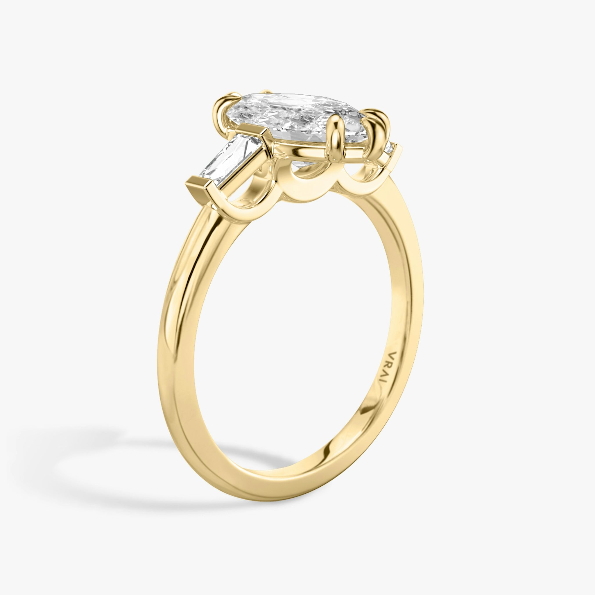 The Three Stone | Marquise | 18k | Yellow Gold | bandAccent: Plain | sideStoneCarat: 0.10ct | sideStoneShape: Tapered Baguette | diamondOrientation: vertical | caratWeight: other