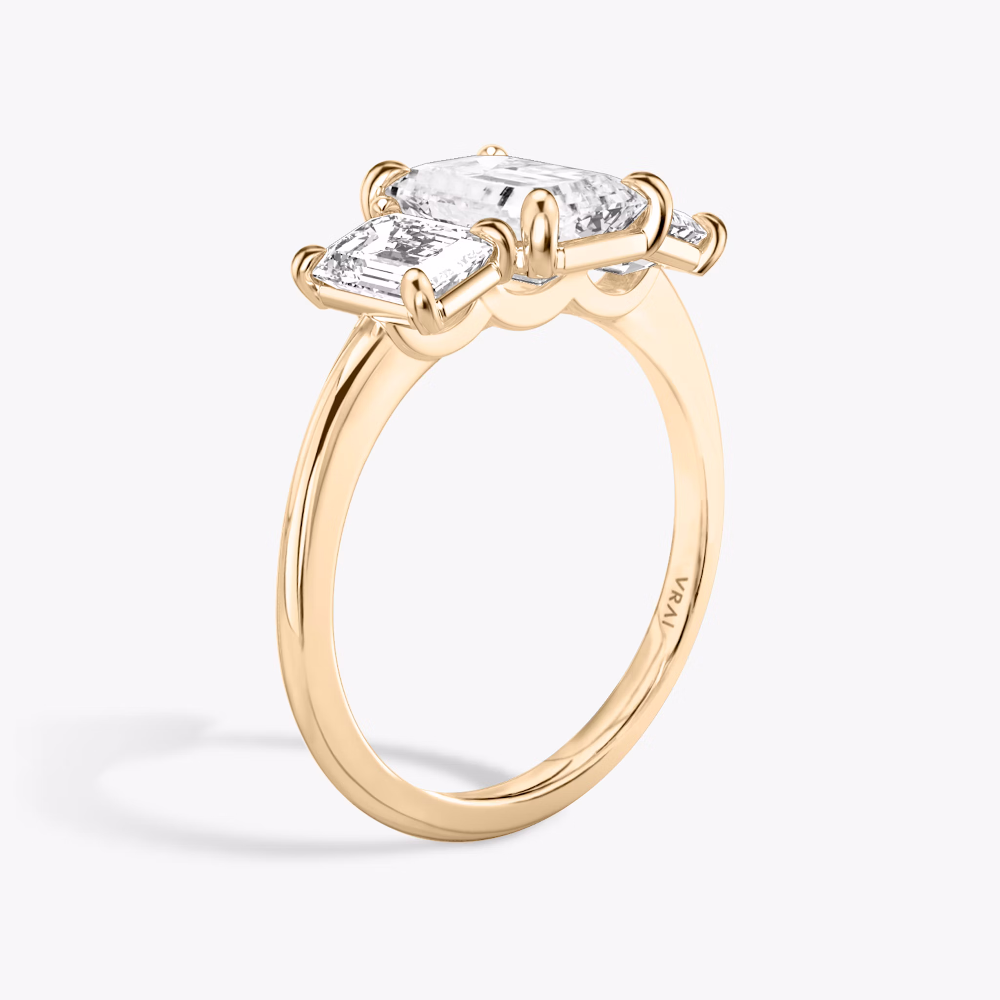 The Three Stone | Emerald | 14k | Rose Gold | bandAccent: Plain | sideStoneCarat: 0.50ct | sideStoneShape: Emerald | diamondOrientation: vertical | caratWeight: other