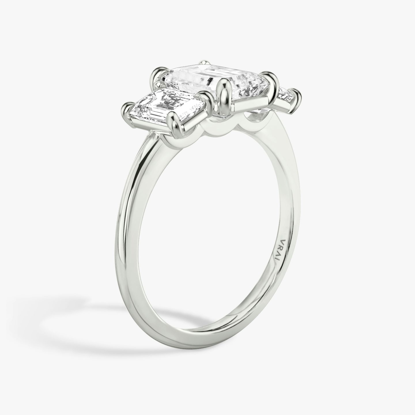 The Three Stone | Emerald | Platinum | bandAccent: Plain | sideStoneCarat: 0.50ct | sideStoneShape: Emerald | diamondOrientation: vertical | caratWeight: other