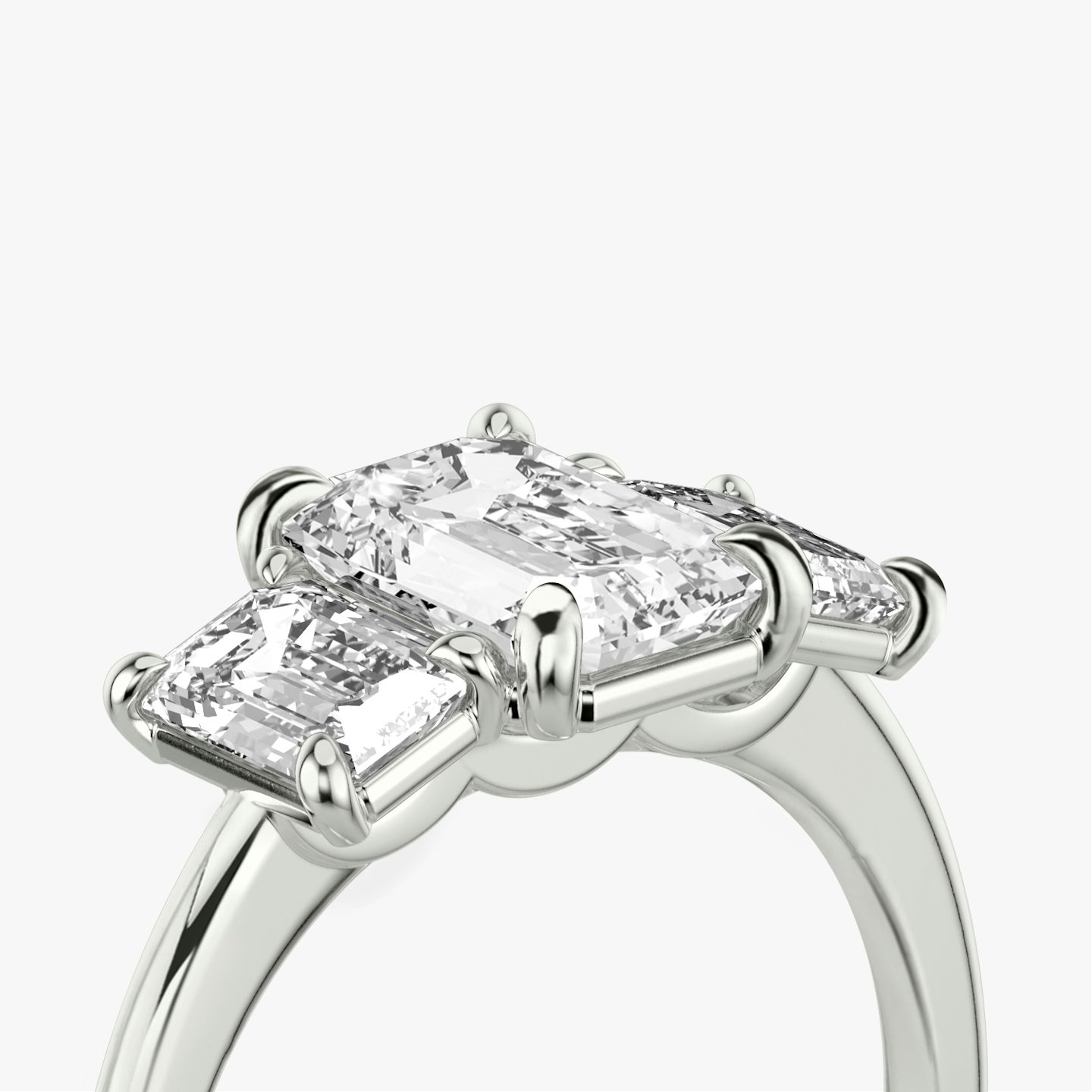 The Three Stone | Emerald | Platinum | bandAccent: Plain | sideStoneCarat: 0.50ct | sideStoneShape: Emerald | diamondOrientation: vertical | caratWeight: other