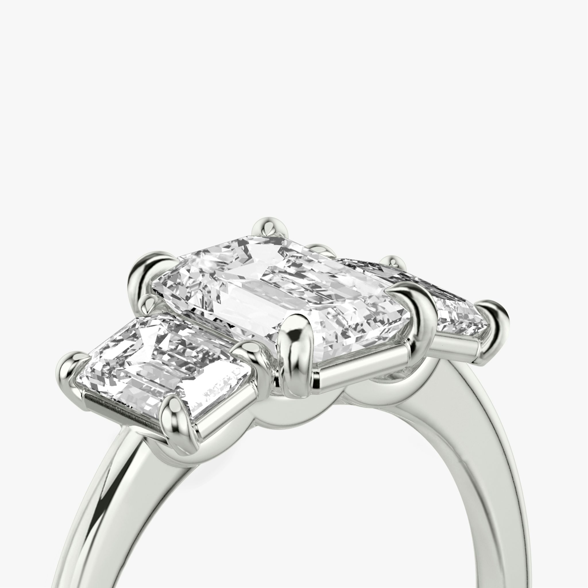 The Three Stone | Emerald | 18k | White Gold | bandAccent: Plain | sideStoneCarat: 0.50ct | sideStoneShape: Emerald | diamondOrientation: vertical | caratWeight: other