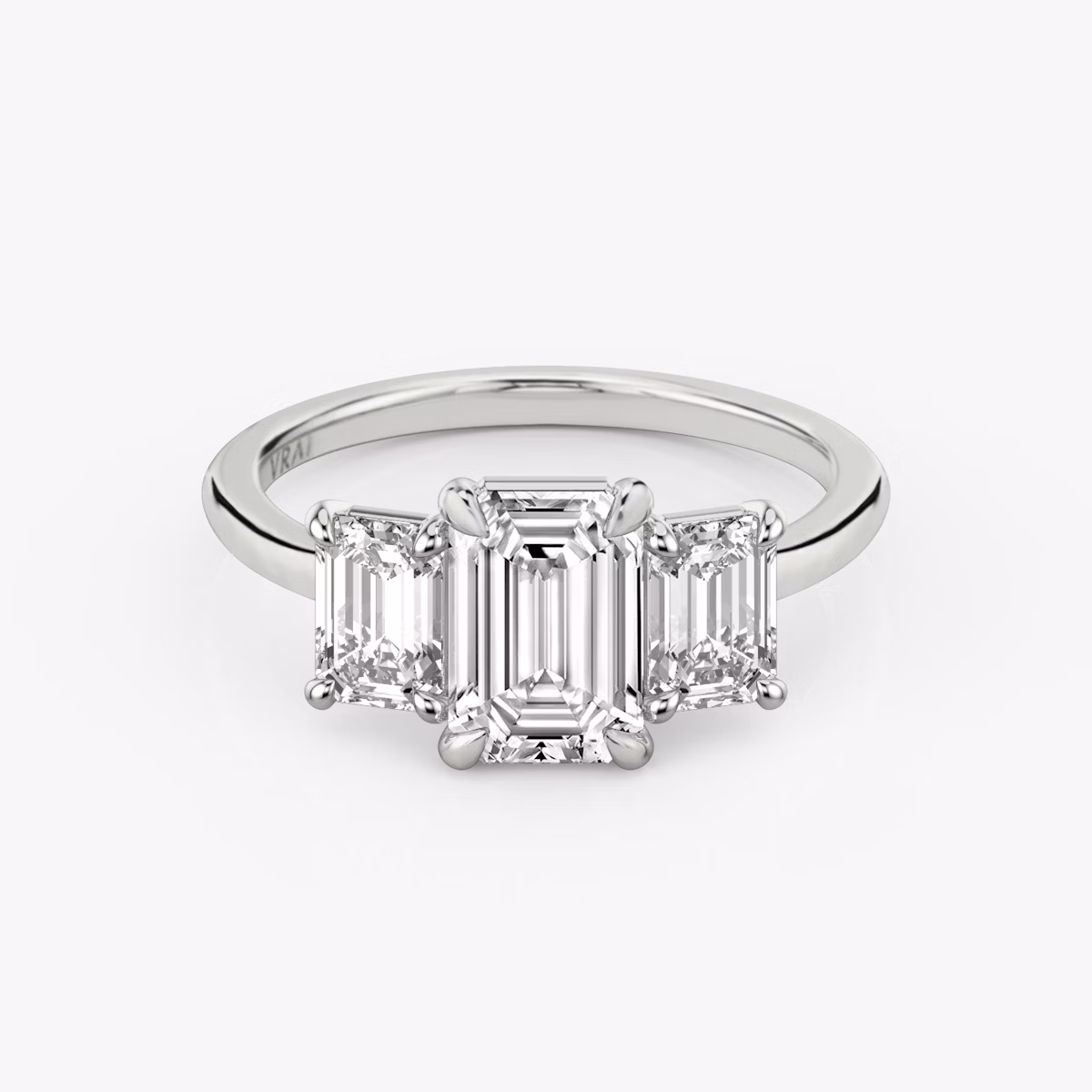 The Three Stone | Emerald | Platinum | bandAccent: Plain | sideStoneCarat: 0.50ct | sideStoneShape: Emerald | diamondOrientation: vertical | caratWeight: other