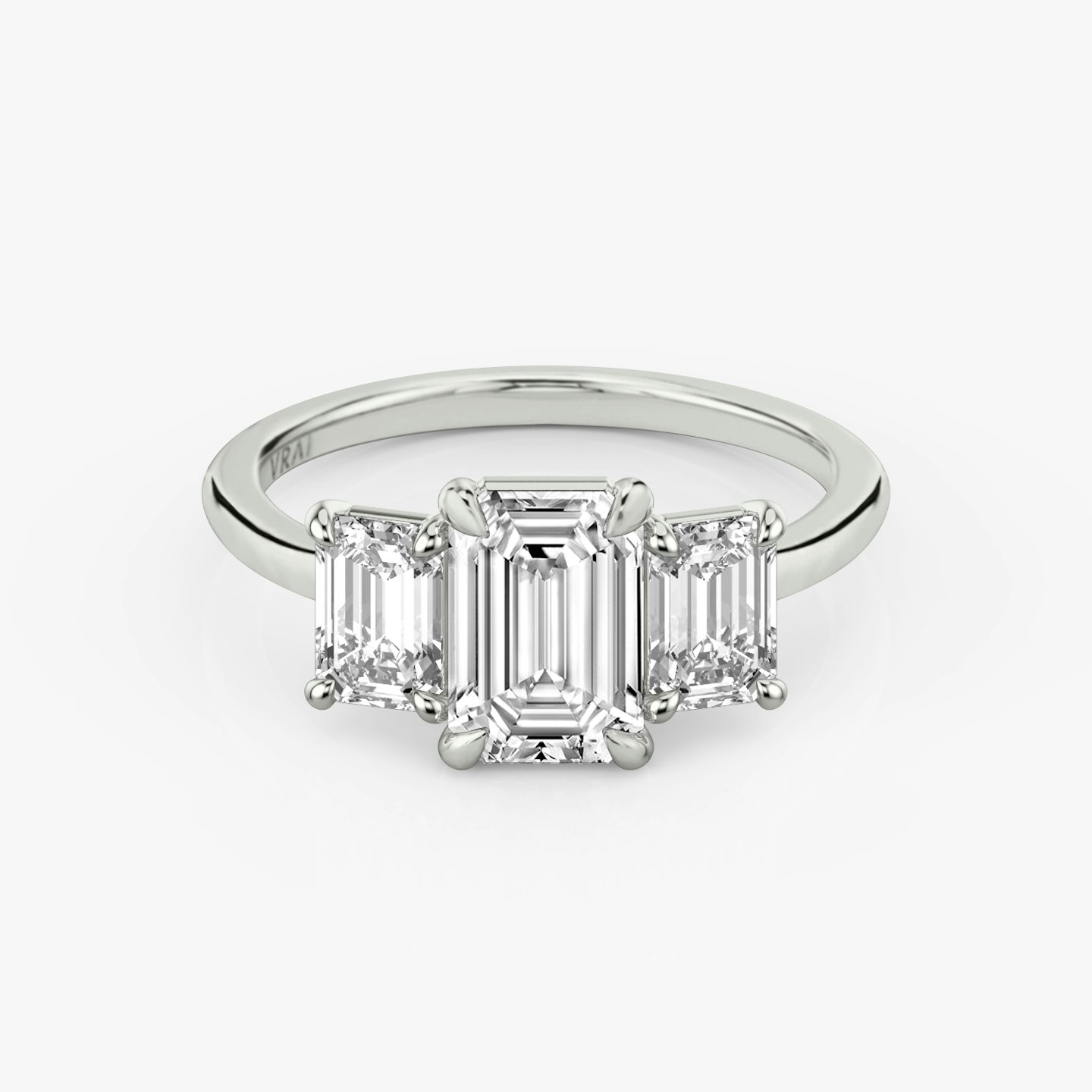 The Three Stone | Emerald | Platinum | bandAccent: Plain | sideStoneCarat: 0.50ct | sideStoneShape: Emerald | diamondOrientation: vertical | caratWeight: other