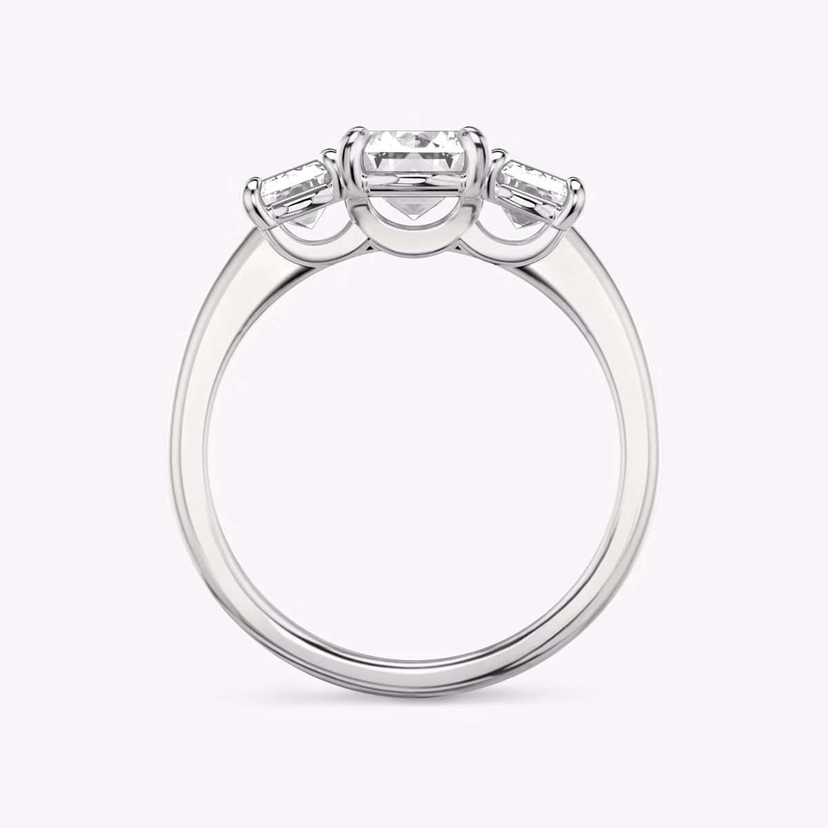 The Three Stone | Emerald | Platinum | bandAccent: Plain | sideStoneCarat: 0.50ct | sideStoneShape: Emerald | diamondOrientation: vertical | caratWeight: other