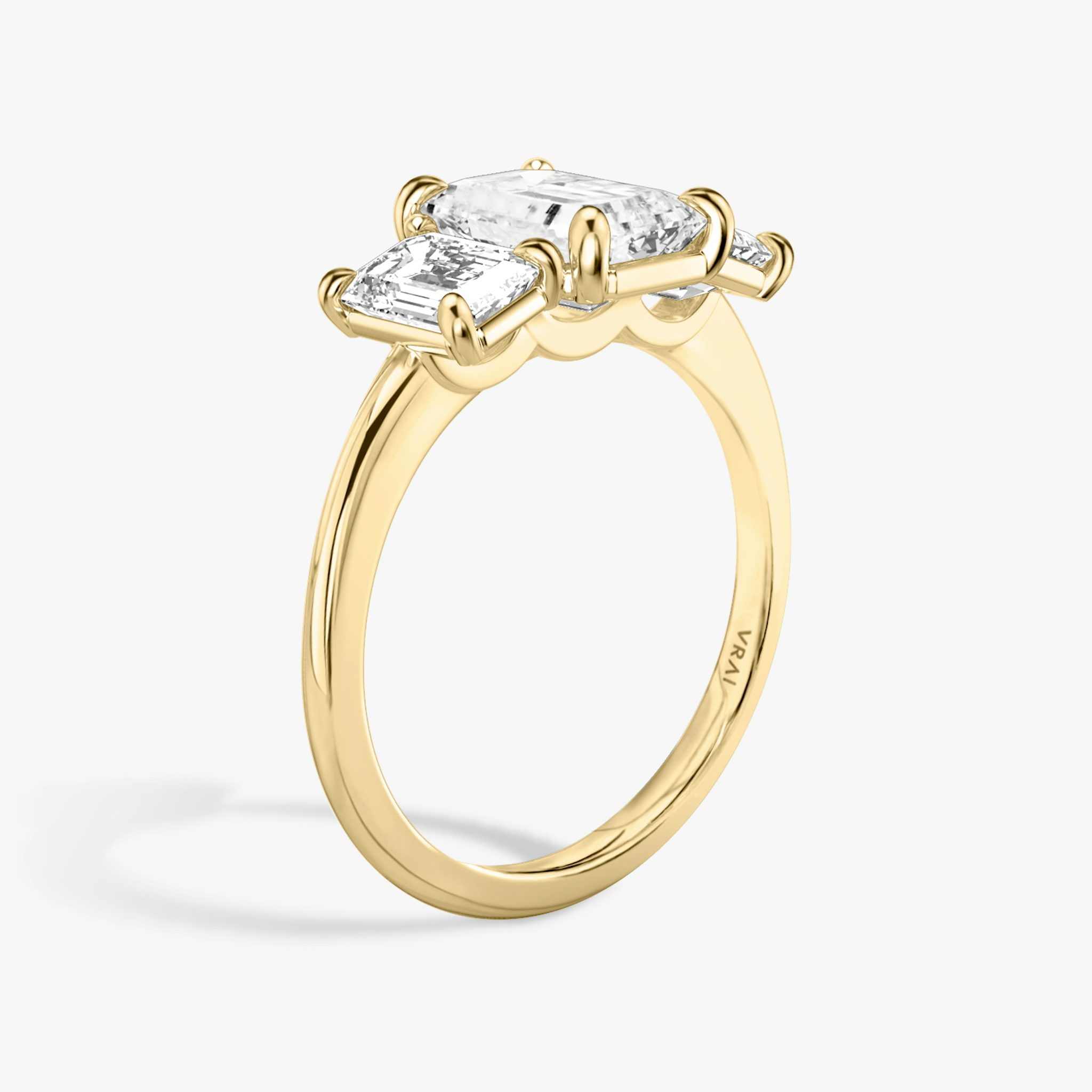 The Three Stone | Emerald | 18k | Yellow Gold | bandAccent: Plain | sideStoneCarat: 0.50ct | sideStoneShape: Emerald | diamondOrientation: vertical | caratWeight: other