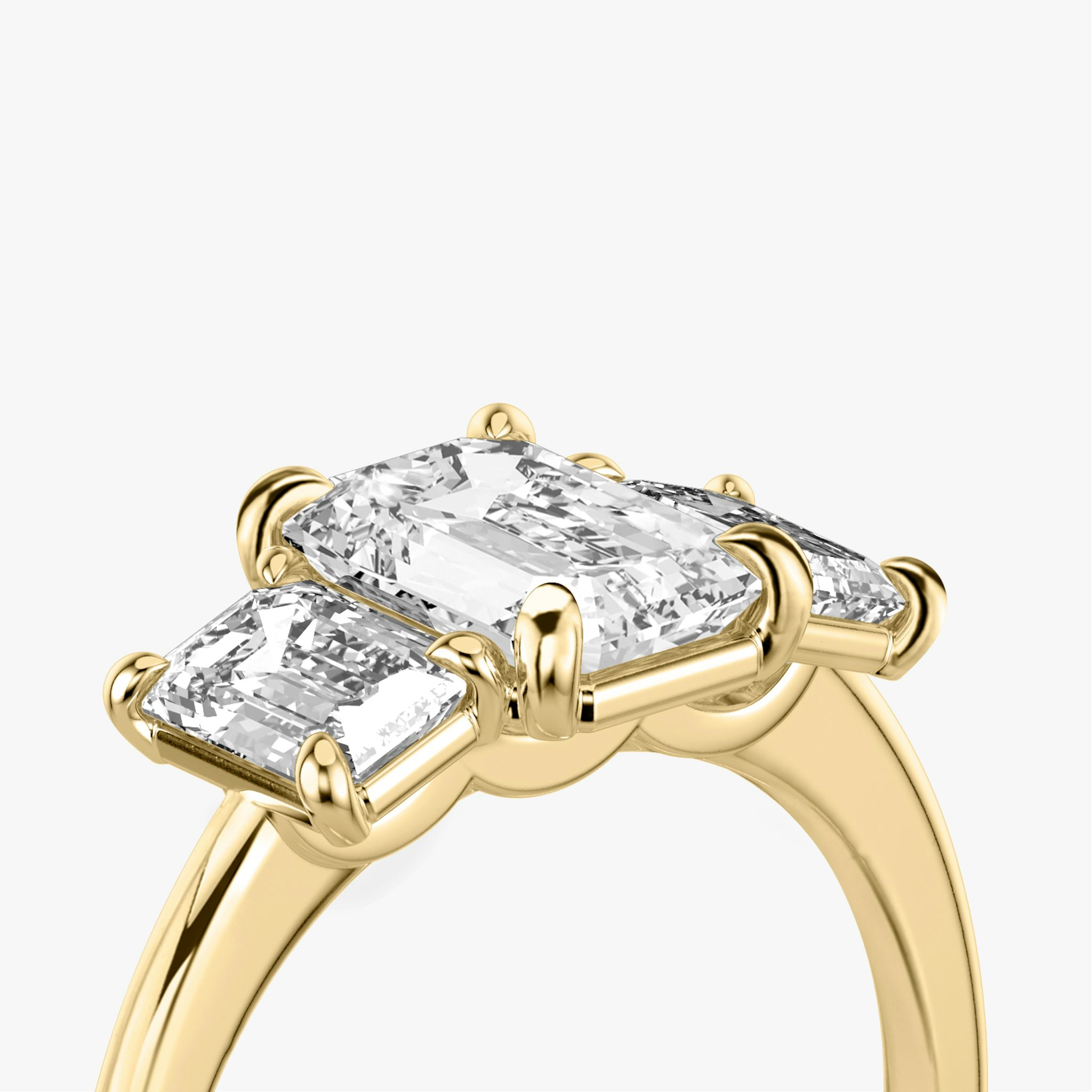 The Three Stone | Emerald | 18k | Yellow Gold | bandAccent: Plain | sideStoneCarat: 0.50ct | sideStoneShape: Emerald | diamondOrientation: vertical | caratWeight: other