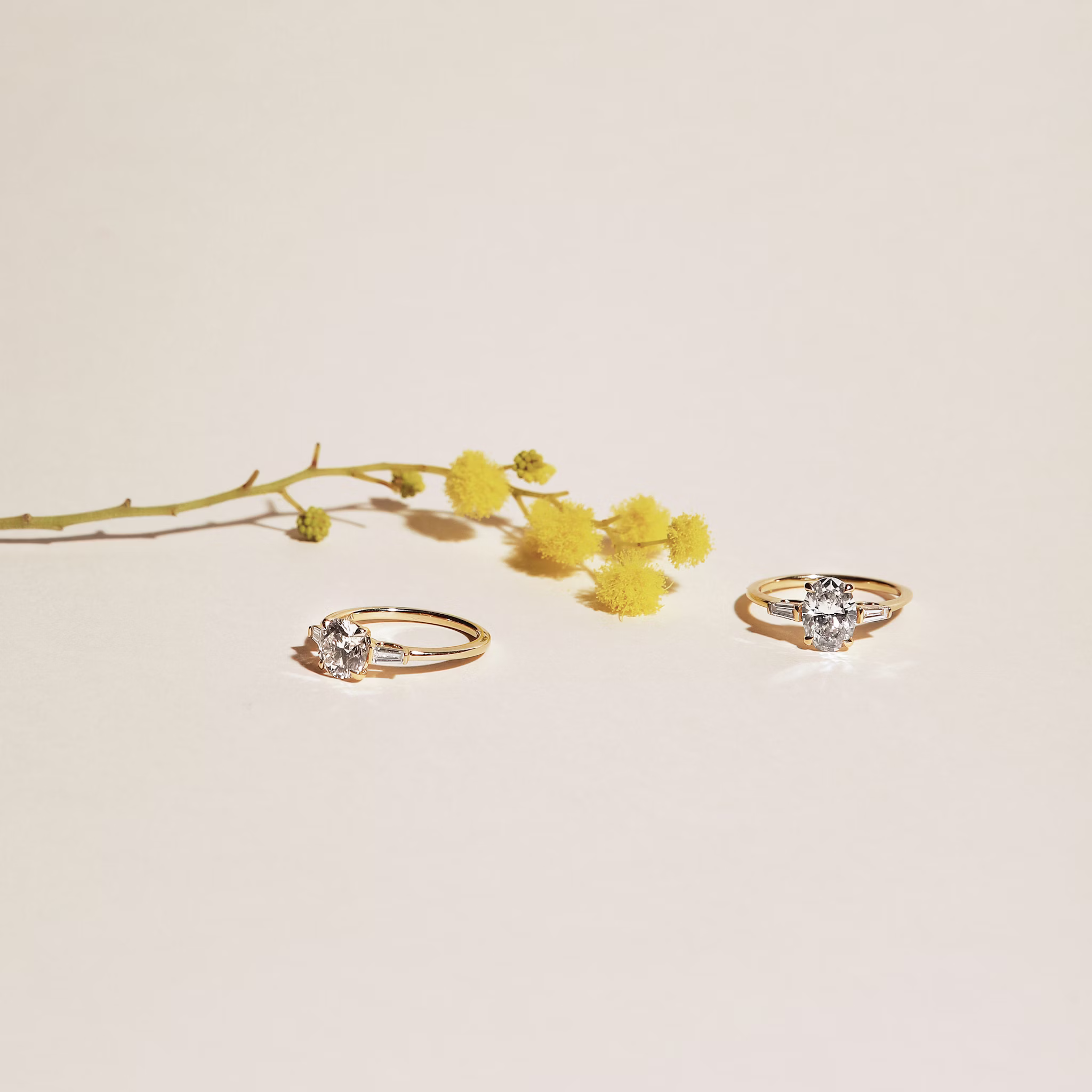 The Three Stone | Round Brilliant | 18k | Yellow Gold | bandAccent: Plain | caratWeight: other | sideStoneCarat: 0.10ct | sideStoneShape: Tapered Baguette | diamondOrientation: vertical