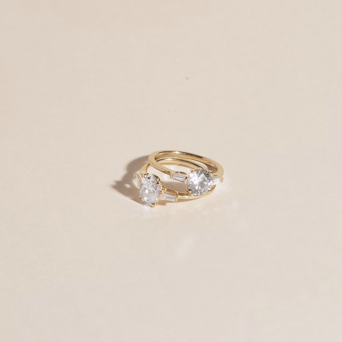 The Three Stone | Round Brilliant | 18k | White Gold | bandAccent: Pavé | caratWeight: other | sideStoneCarat: 0.10ct | sideStoneShape: Tapered Baguette | diamondOrientation: vertical