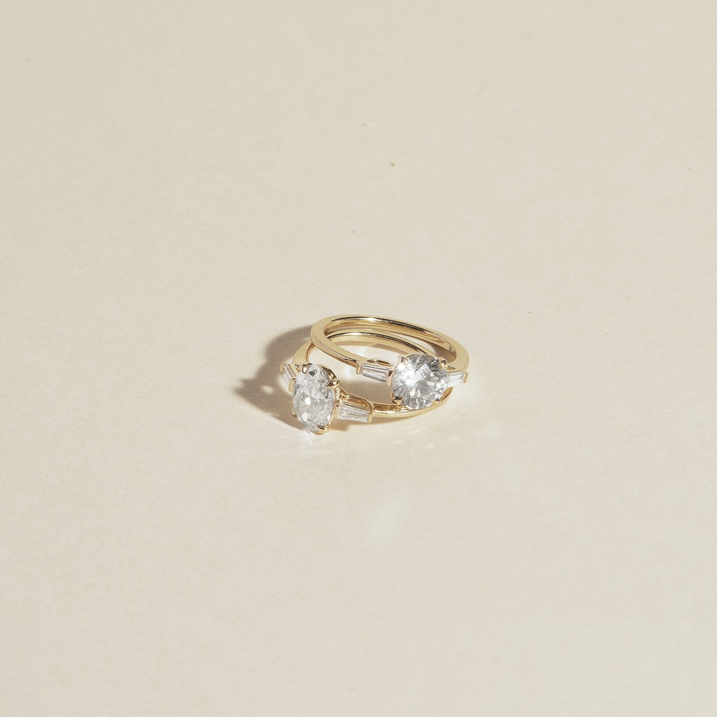 The Three Stone | Round Brilliant | 14k | Rose Gold | bandAccent: Pavé | caratWeight: other | sideStoneCarat: 0.10ct | sideStoneShape: Tapered Baguette | diamondOrientation: vertical