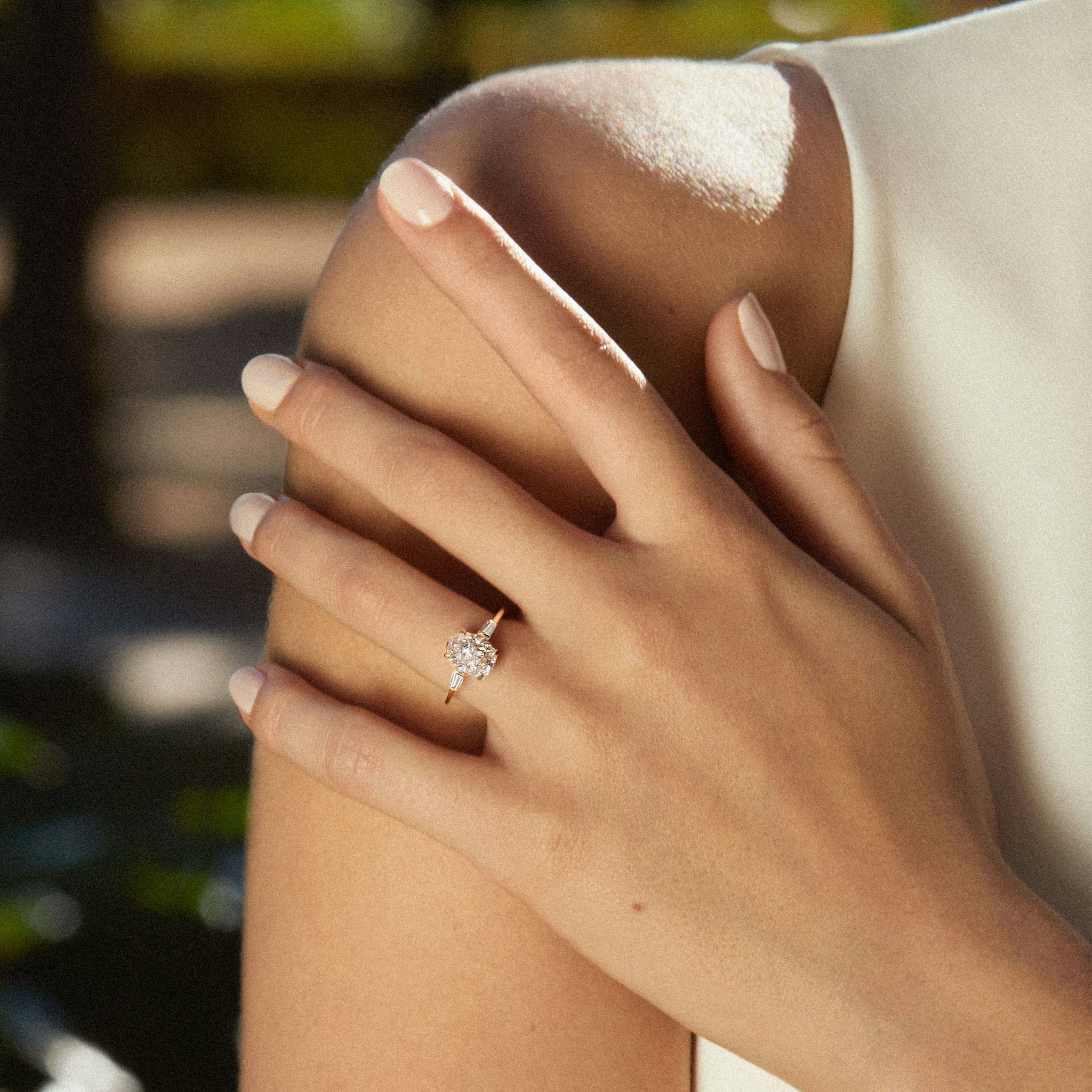 The Three Stone | Oval | 14k | Rose Gold | bandAccent: Plain | sideStoneCarat: 0.10ct | sideStoneShape: Tapered Baguette | diamondOrientation: vertical | caratWeight: other