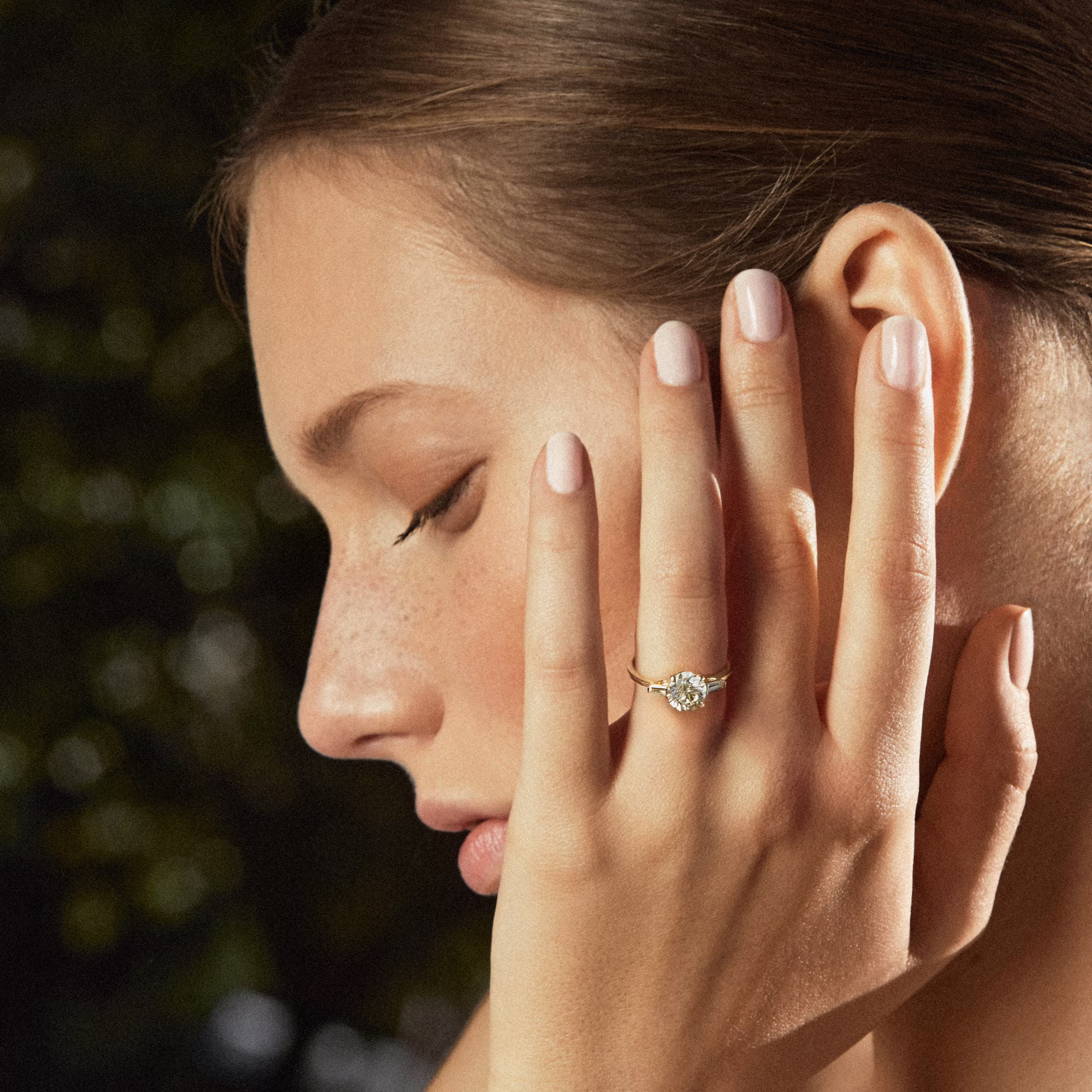 The Three Stone | Round Brilliant | Platinum | bandAccent: Plain | caratWeight: other | sideStoneCarat: 0.10ct | sideStoneShape: Tapered Baguette | diamondOrientation: vertical