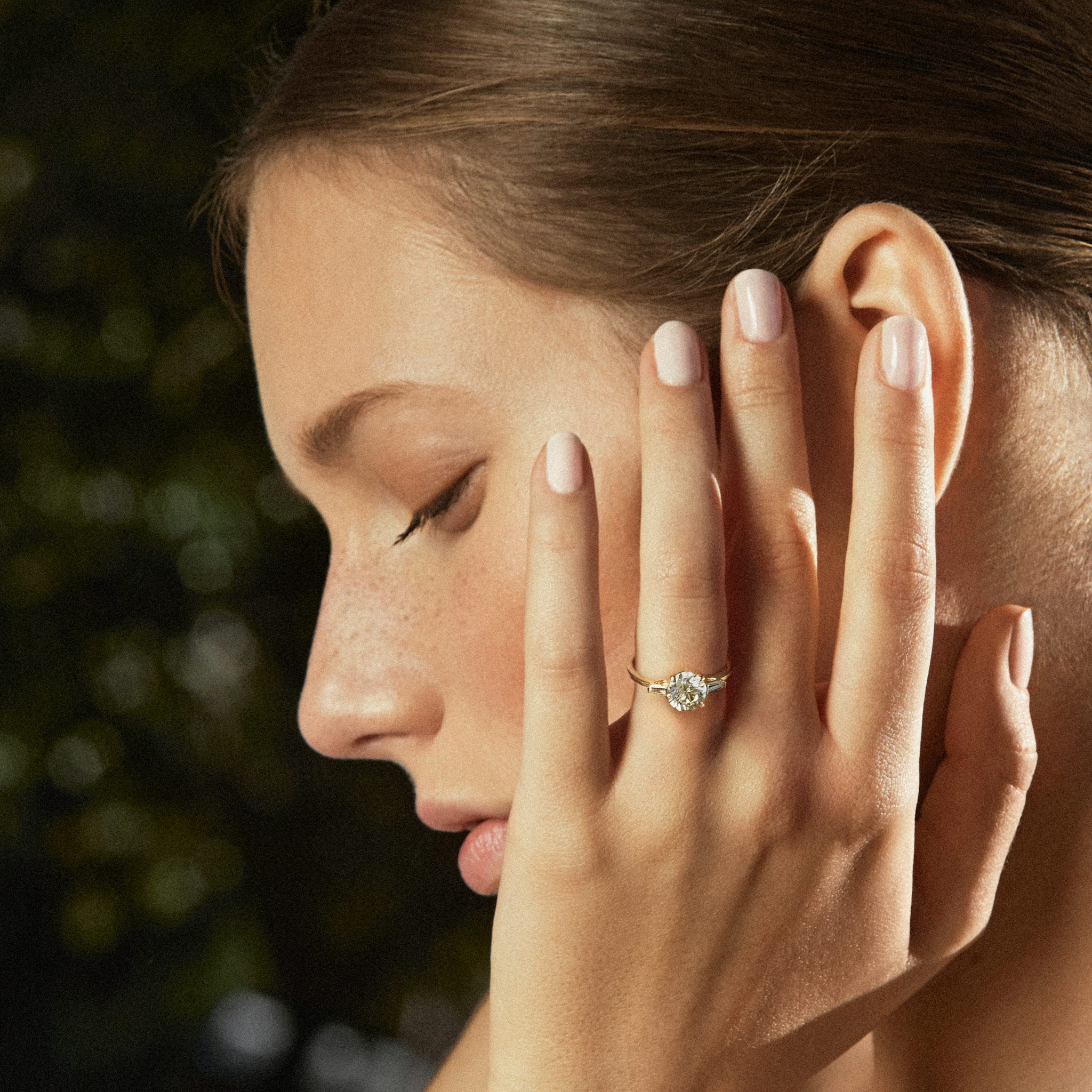 The Three Stone | Round Brilliant | Platinum | bandAccent: Plain | caratWeight: other | sideStoneCarat: 0.10ct | sideStoneShape: Tapered Baguette | diamondOrientation: vertical