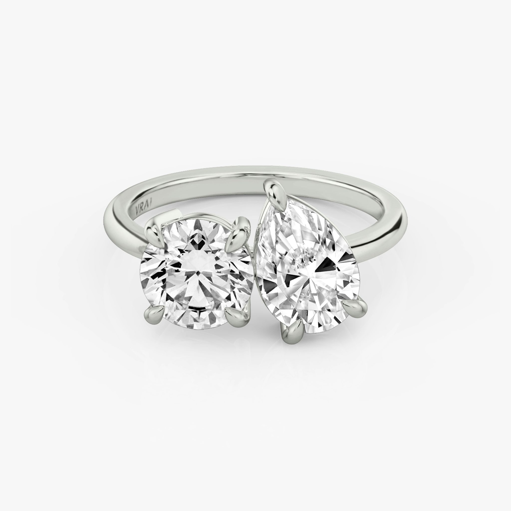 The Toi et Moi | Round Brilliant and Pear | Platinum | bandAccent: Plain | diamondOrientation: vertical | caratWeight: other
