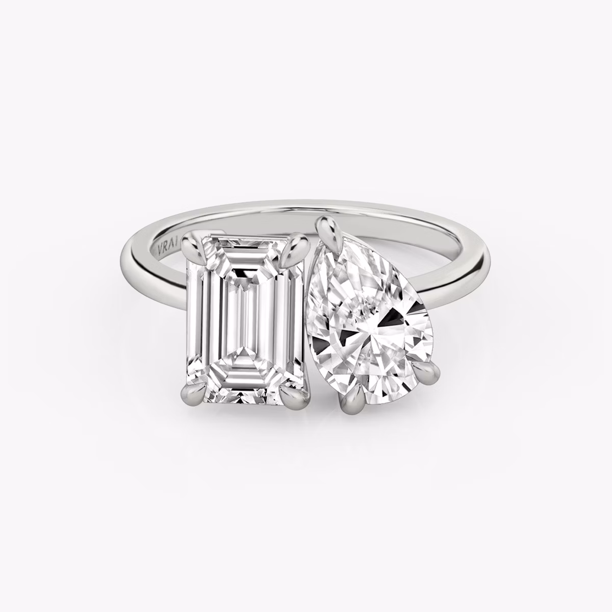 The Toi et Moi | Emerald and Pear | Platinum | bandAccent: Plain | diamondOrientation: vertical | caratWeight: other