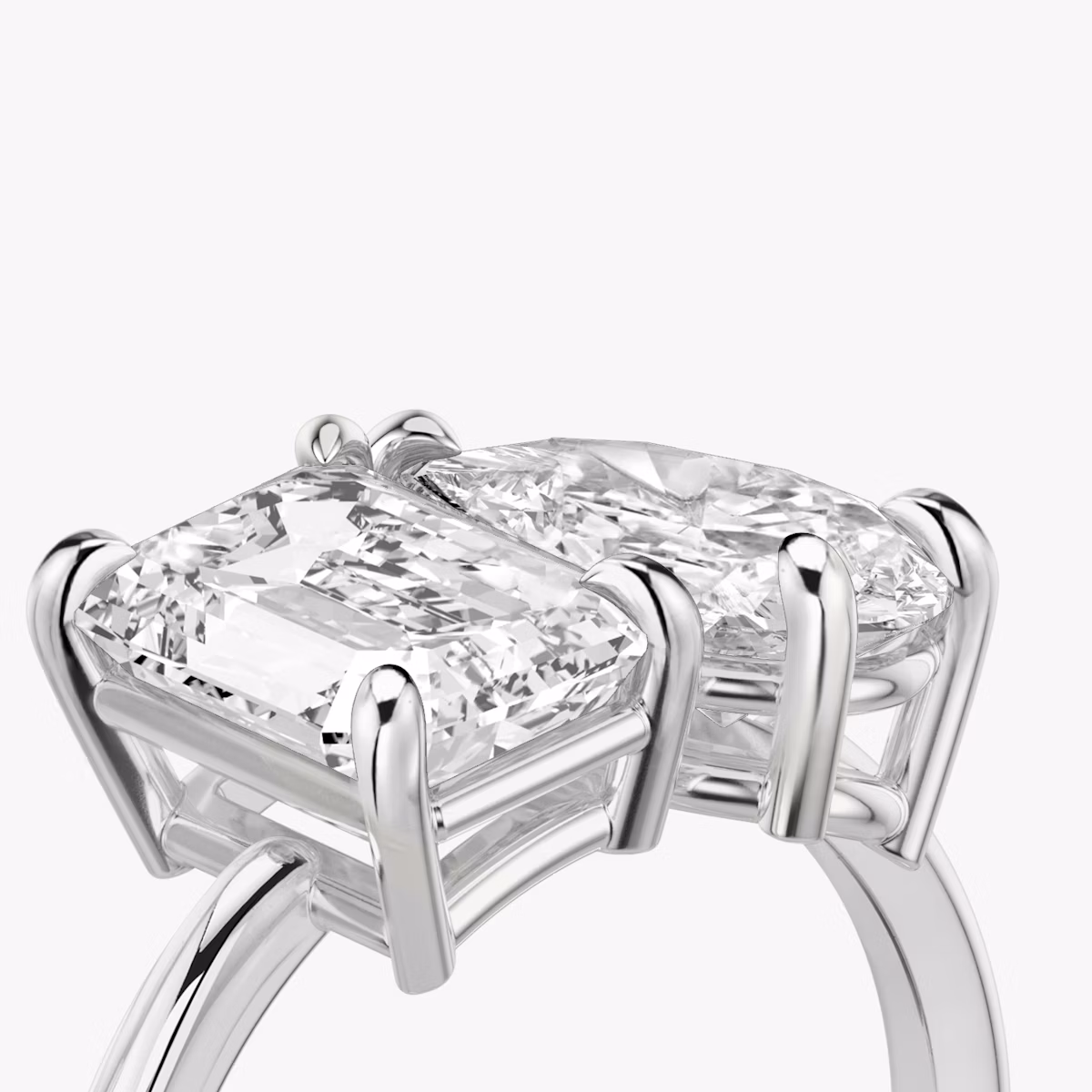 The Toi et Moi | Emerald and Pear | Platinum | bandAccent: Plain | diamondOrientation: vertical | caratWeight: other