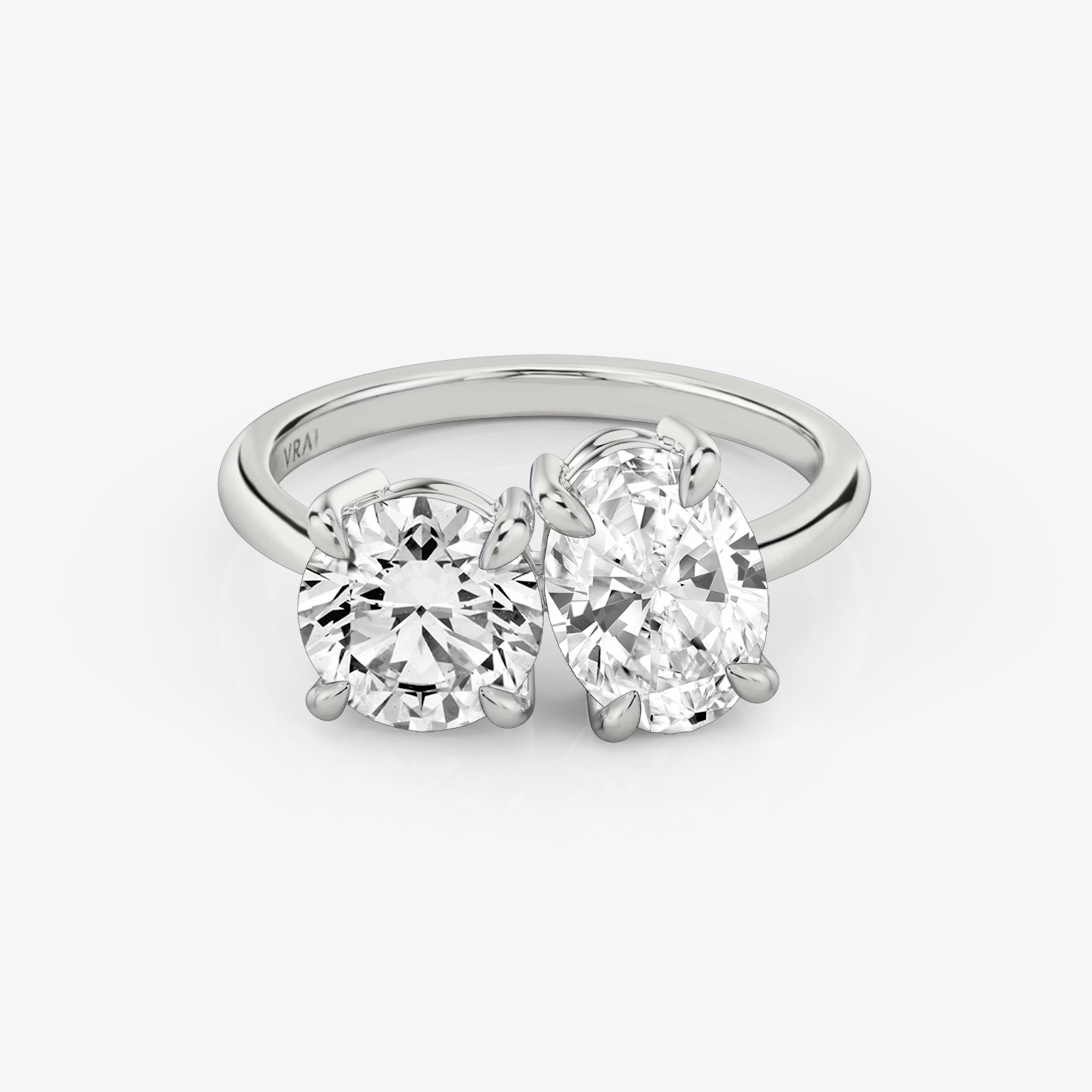 The Toi et Moi | Round Brilliant and Oval | Platinum | bandAccent: Plain | diamondOrientation: vertical | caratWeight: other